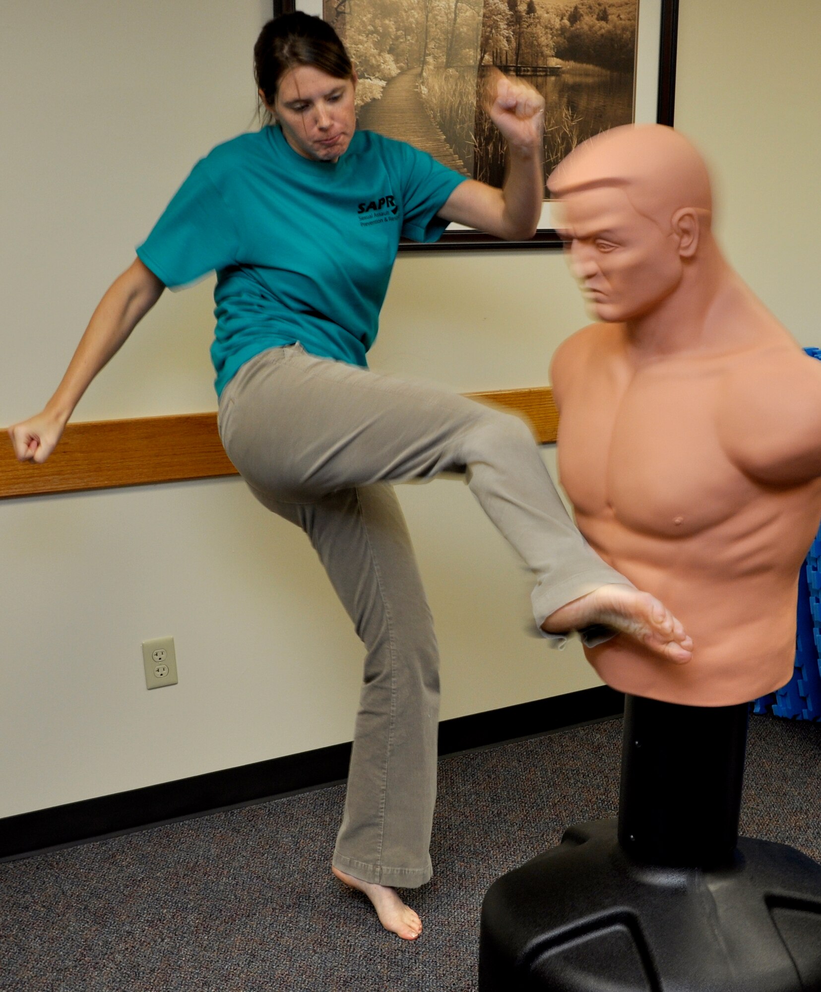 Savannah Lohn practices a self-defense technique she will be teaching during Target Hardening Self Defense classes offered at Vance Air Force Base, Okla., by the Sexual Assault Prevention and Response office. Lohn is the SAPR assistant and a certified instructor. (U.S. Air Force photo/ Airman 1st Class Frank John Casciotta)