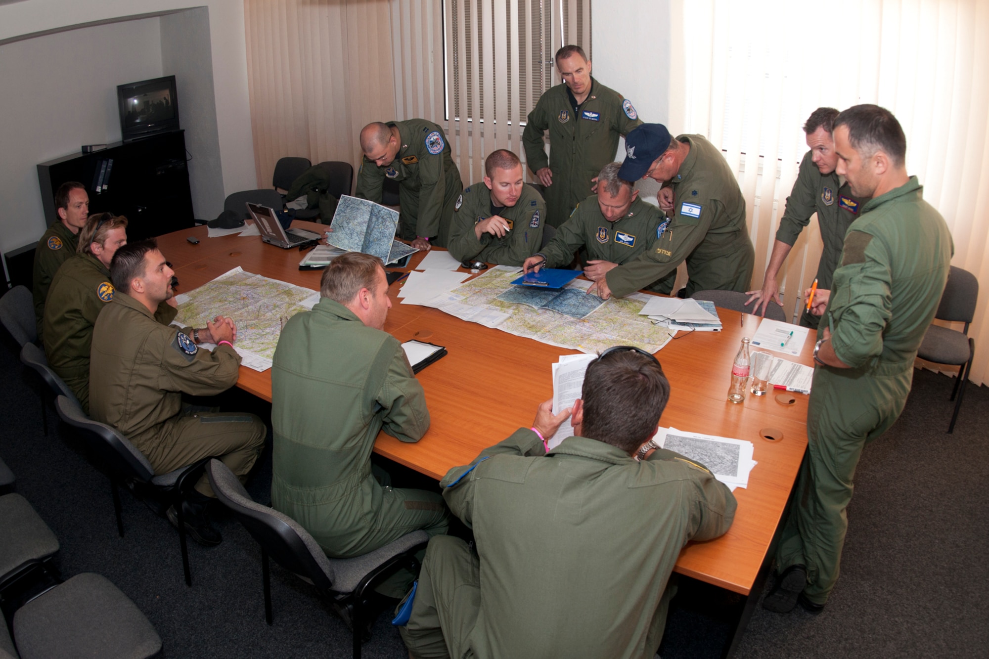 Airmen from both the U.S. Air Force and Czech Republic air force plan the first ever combined mission between the two countries, Ostrava, Czech Republic, Sept. 25, 2011. The historic mission was flown the next day and involved an Air Force Reserve Command B-52 Stratofortress from the 93rd Bomb Squadron, 307th Bomb Wing, Barksdale Air Force Base, La., two Saab JAS 39C Gripens and three Areo L 159 ALCAs (Advanced Light Combat Aircraft) from the Czech Republic air force. (U.S. Air Force photo by Tech. Sgt. Jeff Walston/Released)