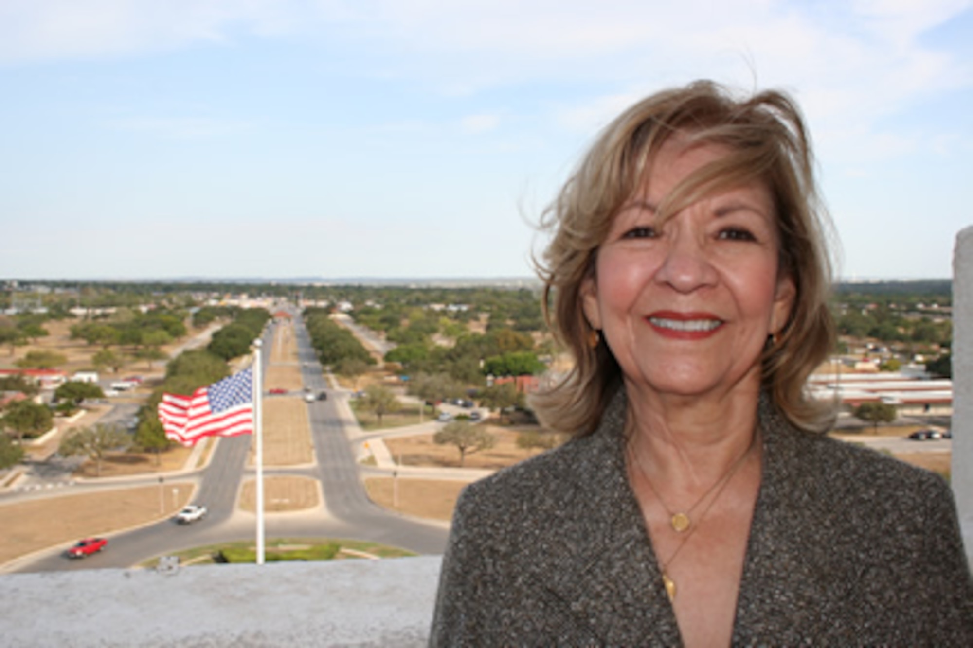 Mary Young, Air Force Personnel Center Civilian Affirmative Employment Program manager, stands on the top deck of the 12th Flying Training Wing headquarters, nicknamed the "Taj Mahal," overlooking Randolph Air Force Base, Texas. Young has served 50 years in Air Force civil service, helping the employment and advancement of women, minorities and those with disabilities. (U.S. Air Force photo/Debbie Gildea) 
