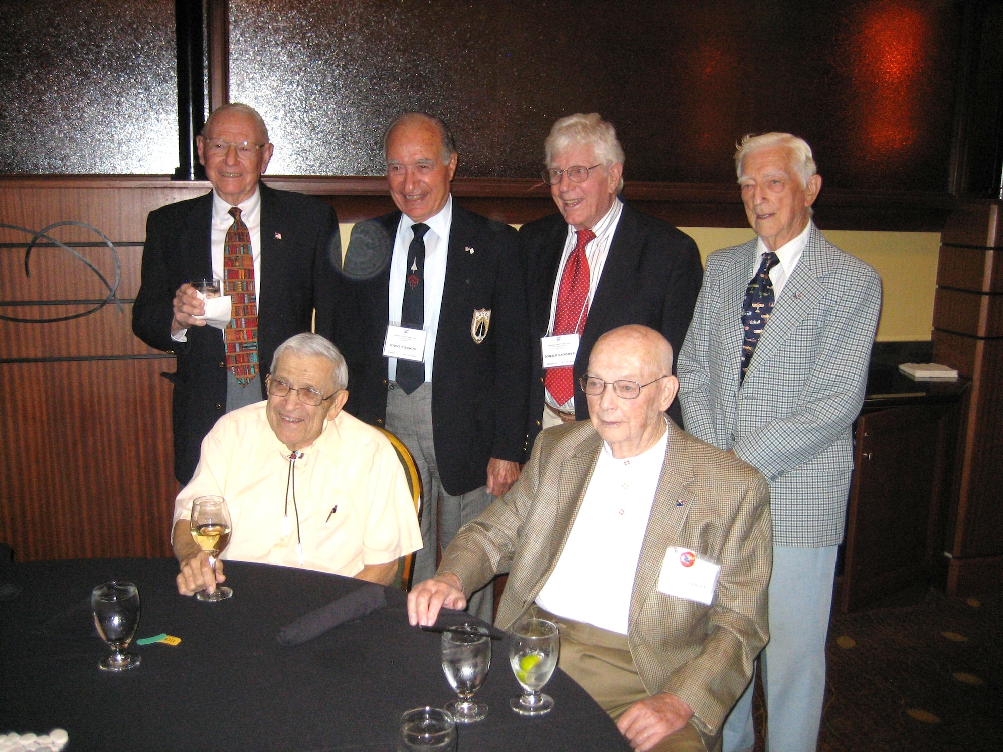 Former Air Force crew chief Don Groomer, pilots Paul Lucas, Richard Rinebolt, Henry Lee, Jack Swan and Steve Pisanos attend the 4th Fighter Group of World War II reunion in Denver, Sept. 24, 2011. The group toured the former Lowry Air Force Base, Colo., which houses the Wings Over the Rockies Air and Space Museum, and attended a memorial banquet for the 4th Fighter Group. The reunion gave the veterans a chance to exchange and relive their experiences during WWII as part of the Royal Eagle Squadrons and to reflect on the changes within the Air Force. (Courtesy photo by Tom Lowery, 4th Fighter Group Historian)