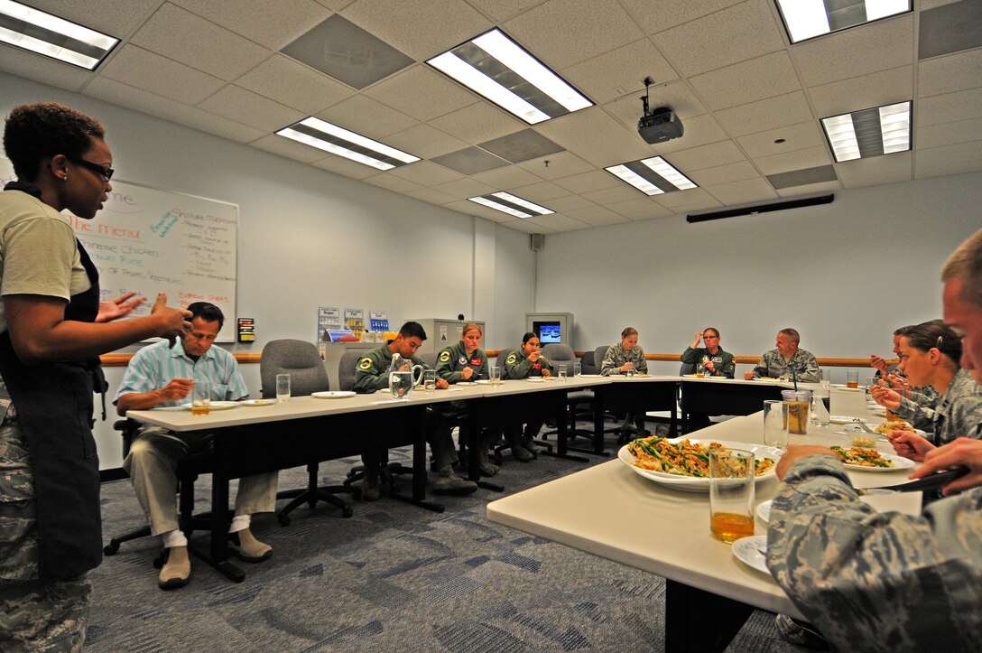 SCHRIEVER AIR FORCE BASE, Colo. -- Staff Sgt. Vanessa Arthur, Schriever Health and Wellness Center dietician, explains the difference between white and black pepper during the HAWC healthy cooking demo here Sept. 28. The demo allows members of Team Schriever to learn about and taste healthier recipes. (U.S. Air Force photo/Staff Sgt. Patrice Clarke)