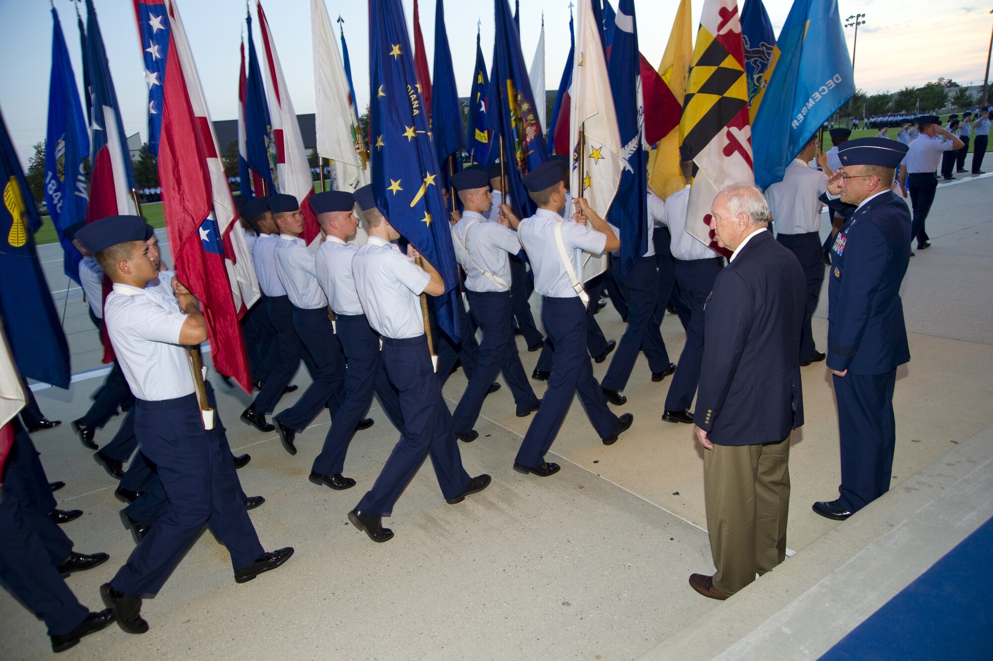 Biloxi Mayor A.J. Holloway, left, and Brig. Gen. Andrew Mueller, 81st Training Wing commander, are the reviewing officials for the student parade, Sept. 29. Mueller salutes as the 50 state flags pass in review.  (U.S. Air Force photo by Adam Bond)