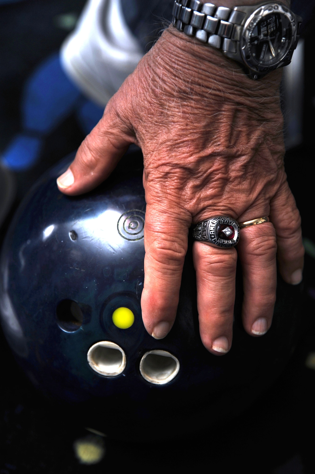 Bernard Moyer earned the ring on his middle finger when he bowled a perfect 300 game 15 years ago at age 74.  (U.S. Air Force photos by Airman 1st Class Heather Heiney)