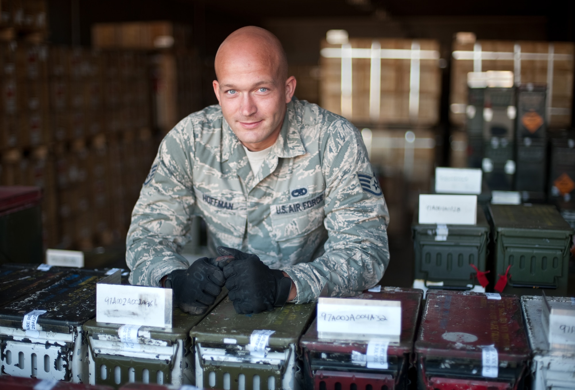 Staff Sgt. Patrick Hoffman, a munitions storage troop,  stands amongst thousands of flare cans maintained by the 60th Maintenance Squadron's muntions flight at Travis Air Force Base, Calif. Hoffman takes "great pride" in the work he and his fellow Airmen do, and feels "doing the job safely" is his number one priority. (U.S. Air Force photo/ Ken Wright)