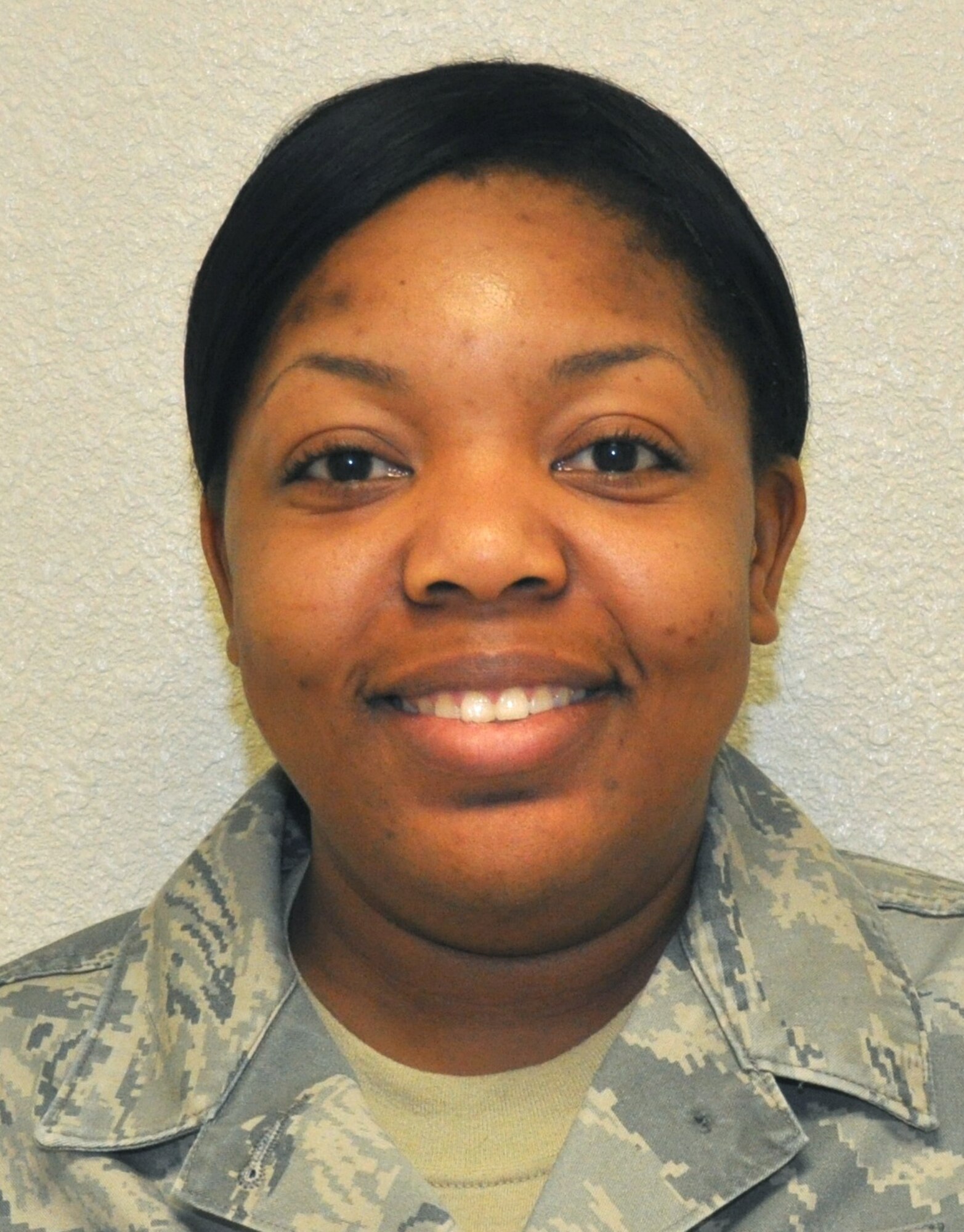 Staff Sgt. Keondra Harris, 81st Medical Support Squadron, is presented the Warrior Award by the Keesler Chiefs Group. (U.S. Air Force photo by Steve Pivnick)