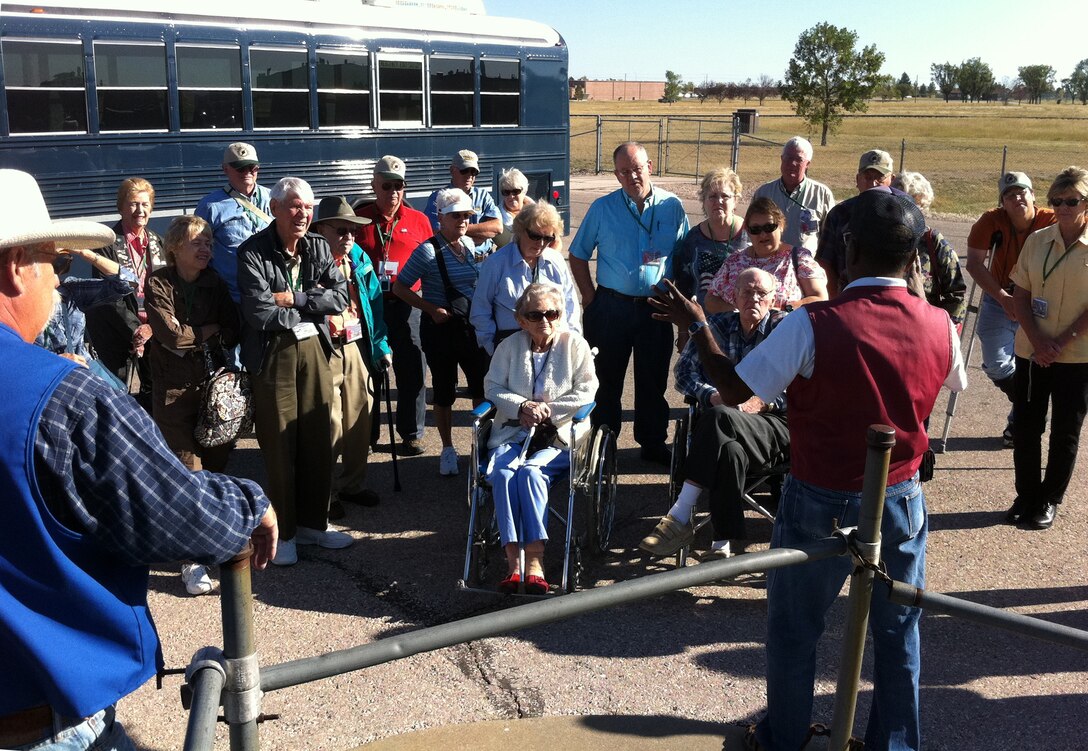 Eight surviving veterans of the 509th Composite Group along with their friends and family listen to a South Dakota Air and Space Museum tour guide explain the outdoor elements of the decommissioned training Minuteman missile silo at Ellsworth Air Force Base, S.D., Sept. 28, 2011. The veterans were visiting the base during their annual week-long reunion, which has been happening for more than 20 years. (U.S. Air Force photo by Tech. Sgt. Nathan Gallahan/Released)