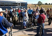 Eight surviving veterans of the 509th Composite Group along with their friends and family listen to a South Dakota Air and Space Museum tour guide explain the outdoor elements of the decommissioned training Minuteman missile silo at Ellsworth Air Force Base, S.D., Sept. 28, 2011. The veterans were visiting the base during their annual week-long reunion, which has been happening for more than 20 years. (U.S. Air Force photo by Tech. Sgt. Nathan Gallahan/Released)