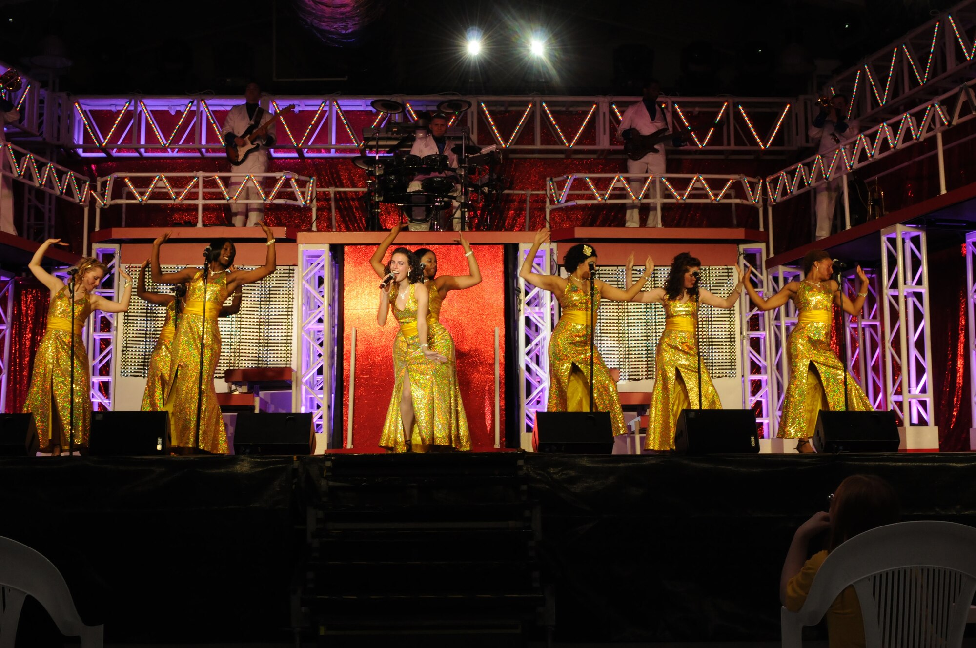 Tops in Blue members perform their timeline music show Sept. 30 at Aviano Air Base, Italy. The Tops in Blue show has entertained military members around the world for nearly 60 years. It featured hit music from the earliest to the newest generation. More than 530 people from Aviano attended to see the performance. (U.S. Air Force Photo/ Airman LaVel Sterling)