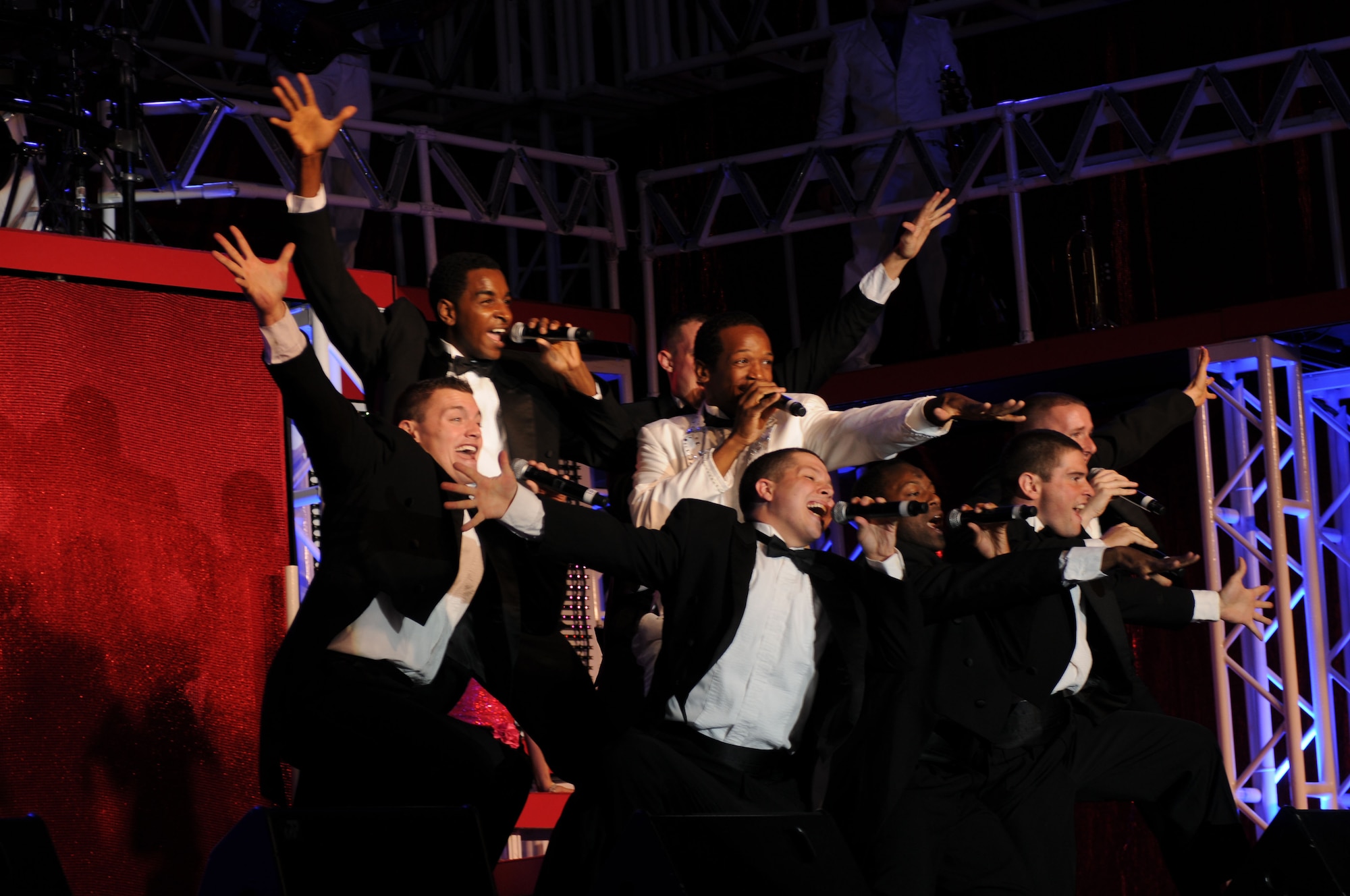 Tops in Blue members perform their timeline music show Sept. 30 at Aviano Air Base, Italy. Tops in Blue are an all-active duty Air Force special unit that performs for service members and their families at various bases and deployed locations around the world. (U.S. Air Force Photo/ Airman LaVel Sterling)