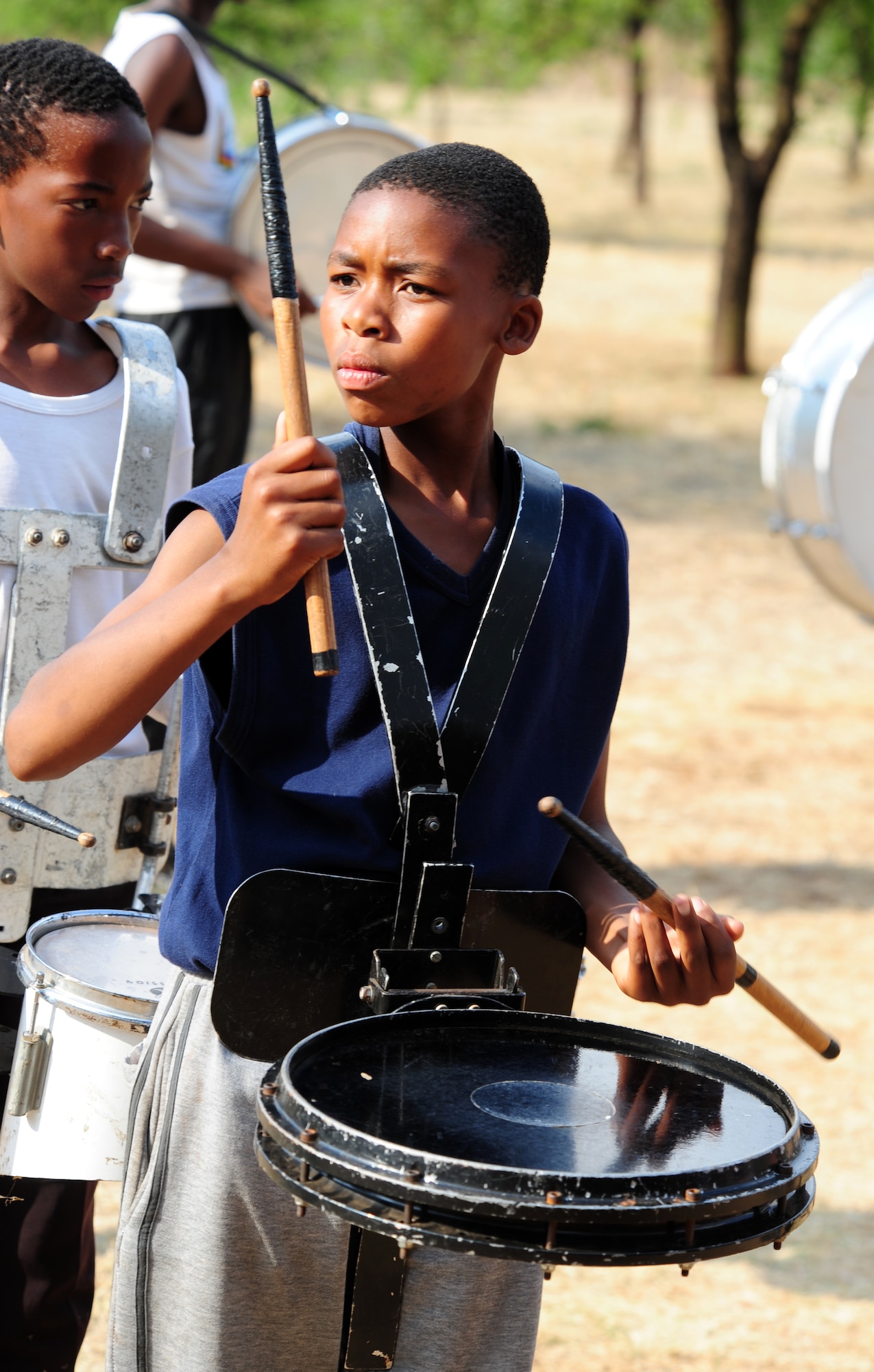 A young drummer from the Cullinan Combined School field band performs for the U.S. Air Forces in Europe band, "Touch 'n Go," at Pretoria, South Africa, Oct. 3. After the "Touch 'n Go" band played, the field band performed for a chance to get some feedback from the six-person team.   (U.S. Air Force photo by Tech. Sgt. Todd Wivell)