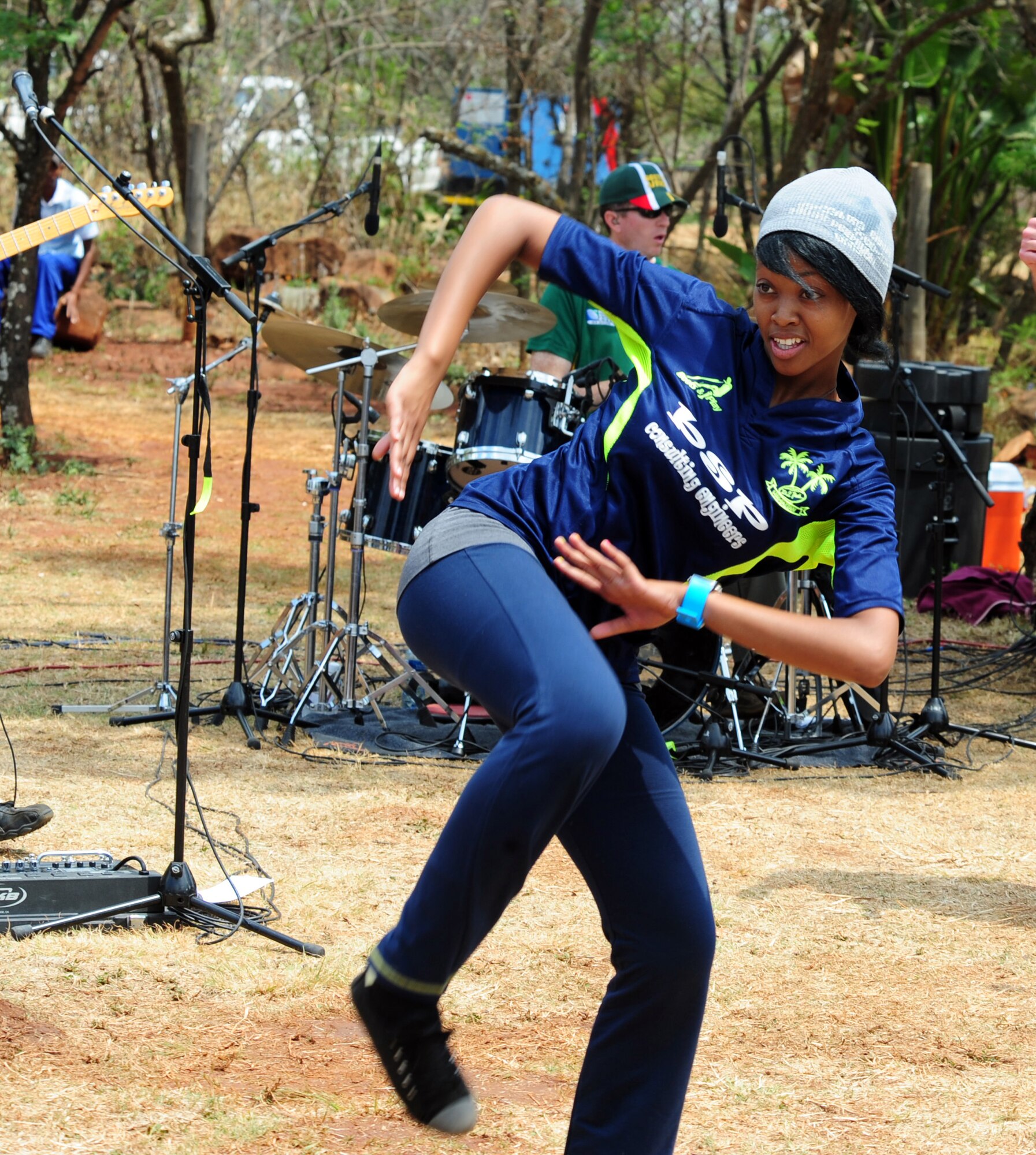 Mary Aphane, Cullinan Combined School dance instructor, dances to a song performed by the U.S. Air Forces in Europe band, "Touch 'n Go," during their live show at Pretoria, South Africa, Oct. 3. Aphane has been with the school since she was a young girl learning to dance and now is an instructor.   (U.S. Air Force photo by Tech. Sgt. Todd Wivell)