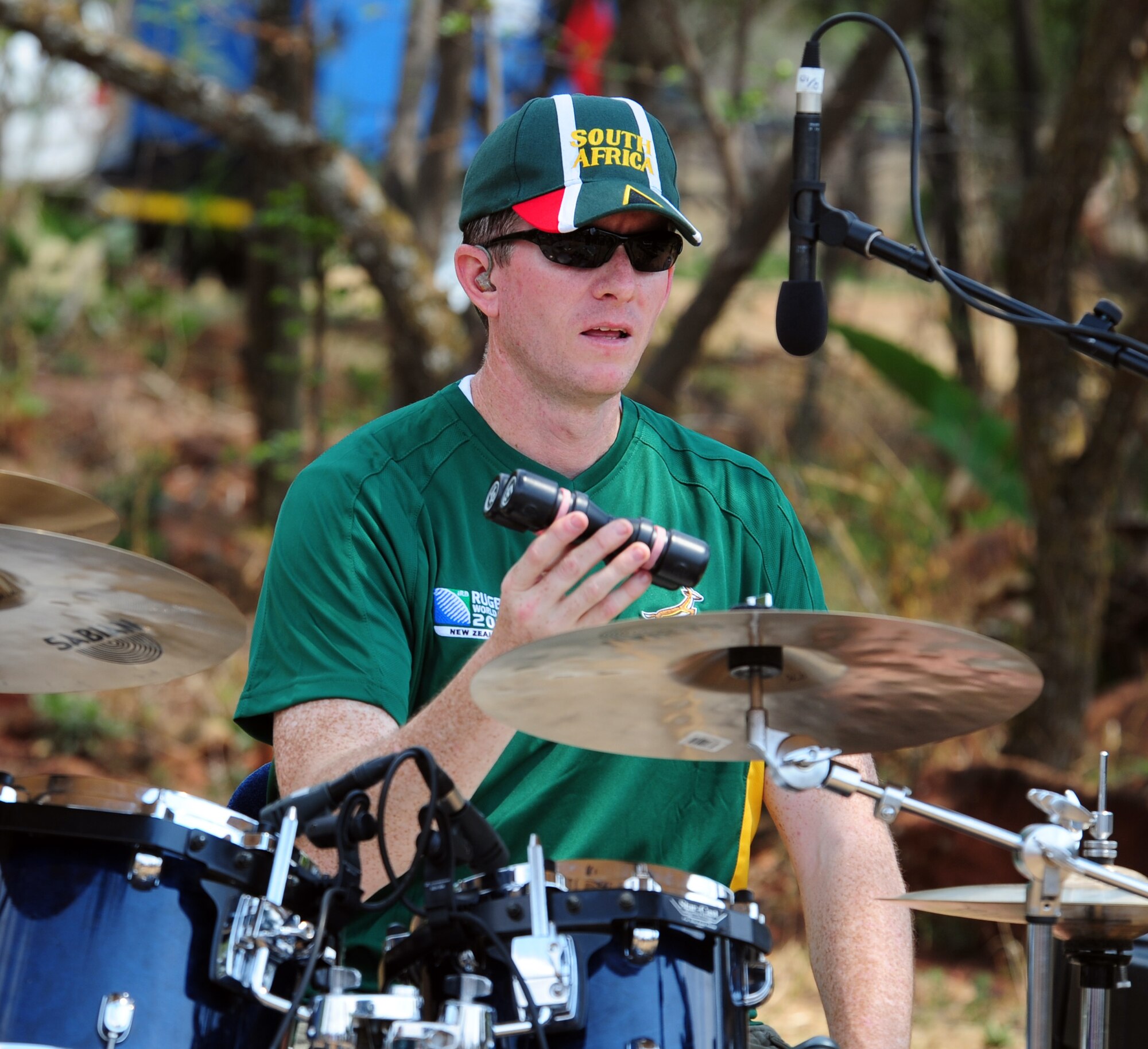 Staff Sgt. Robert Browning, U.S. Air Forces in Europe Band “Touch ‘n Go” lead drummer peforms during a live show to the Cullinan Combined School field band during their trip to Pretoria, South Africa, Oct. 3. The band, who was there in support of the 2011 Air Show and Lifestyle Expo at Waterkloof Air Force Base, visited with the field band twice during their visit. (U.S. Air Force photo by Tech. Sgt. Todd Wivell)