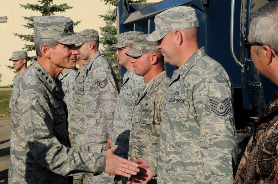 Air Force Chief of Staff Gen. Norton Schwartz greets Airmen Oct. 4, 2011, during a tour of Minot Air Force Base, N.D.  Schwartz expressed his admiration for all the hard work Airmen from the 5th Civil Engineer Squadron contributed during the flooding of the Souris River in Minot, N.D., and surrounding communities. The Airmen are assigned to the 5th CES. (U.S. Air Force photo/Senior Airman Aaron-Forrest Wainwright)