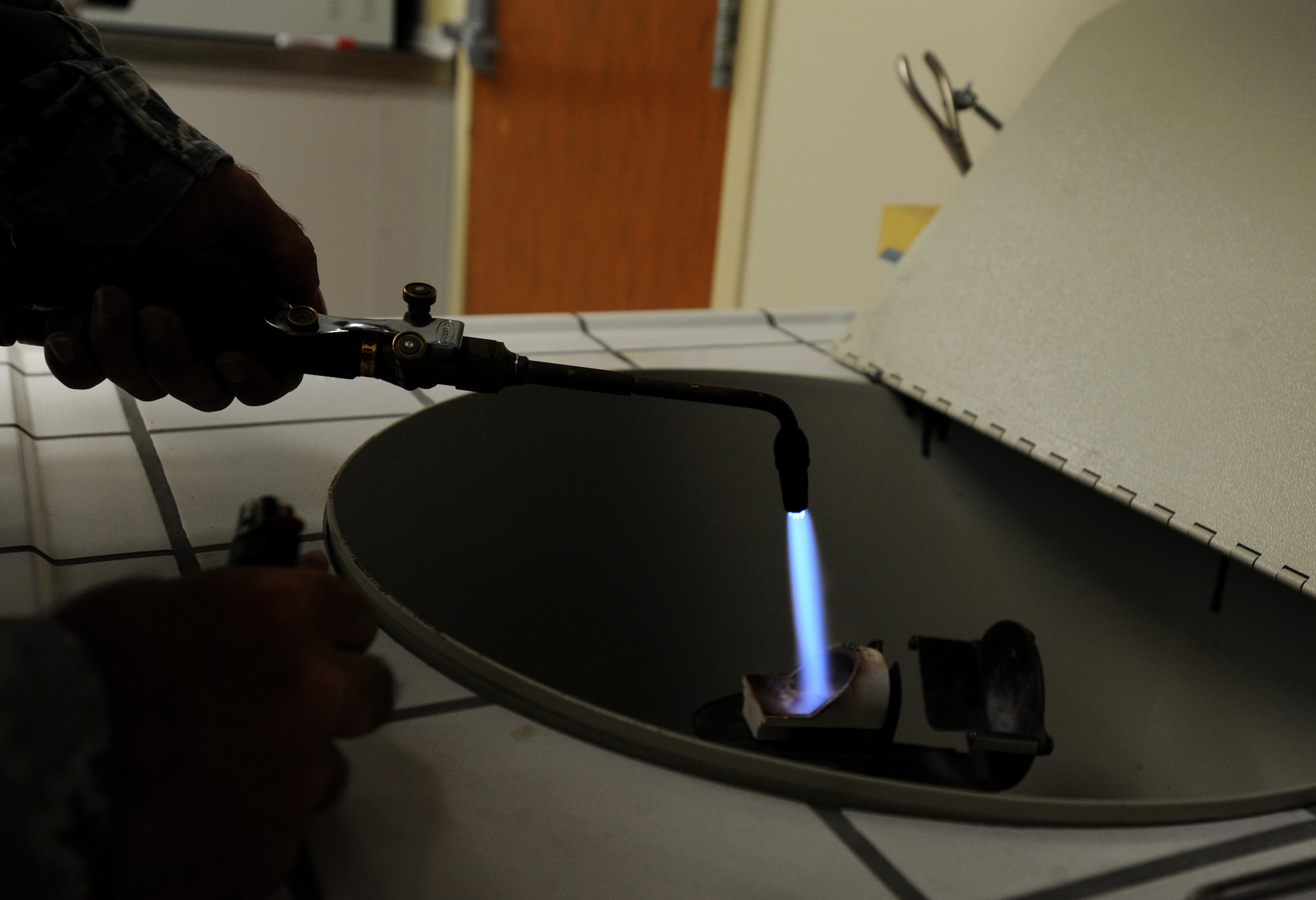 Technical Sgt. Joshuwa Steel melts gold for a crown Sept. 22 at the Dental Lab at Joint Base Charleston-Air Base. Dental Lab technicians fabricate all dental prosthesis, including making retainers, maxillary/mandible expanders, model work for pilots custom flight masks, sports guards, night guards, crowns, bridges and implants. Steel is a Dental Lab technician with the 628 Medical Group. (U.S. Air Force photo/Airman 1st Class Ashlee Galloway)