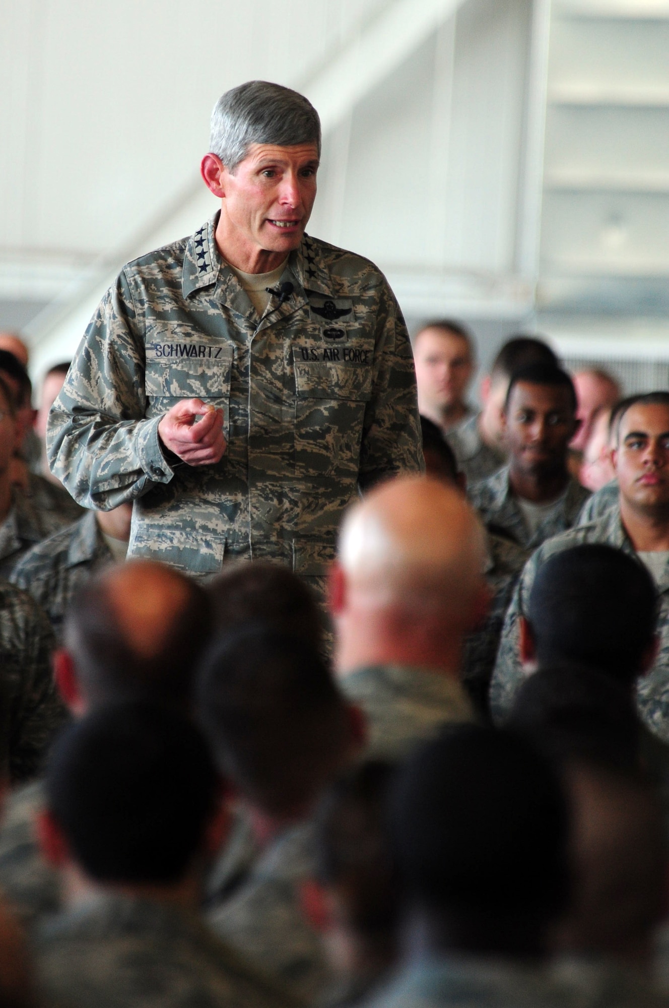 Air Force Chief of Staff Gen. Norton Schwartz speaks to Airmen Oct. 4, 2011, at Minot Air Force Base, N.D., during an all-call. Schwartz expressed gratitude for their efforts in aiding the Minot community, as well as each other, during the flooding this past summer. (U.S. Air Force photo/Senior Airman Michael Veloz)