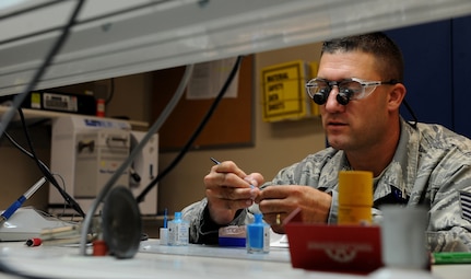 Technical Sergeant Joshuwa Steel adds die spacer to the model work before making a crown Sept. 22 at the Dental Lab at Joint Base Charleston-Air Base. Die spacer is added before making the crown so the Dentist has room to cement the tooth when it is complete. Dental Lab technicians fabricate all dental prosthesis, including making retainers, maxillary/mandible expanders, model work for pilots custom flight masks, sports guards, night guards, crowns, bridges and implants. Steel is a Dental technician with the 628th Medical Group. (U.S. Air Force photo/Airman 1st Class Ashlee Galloway)