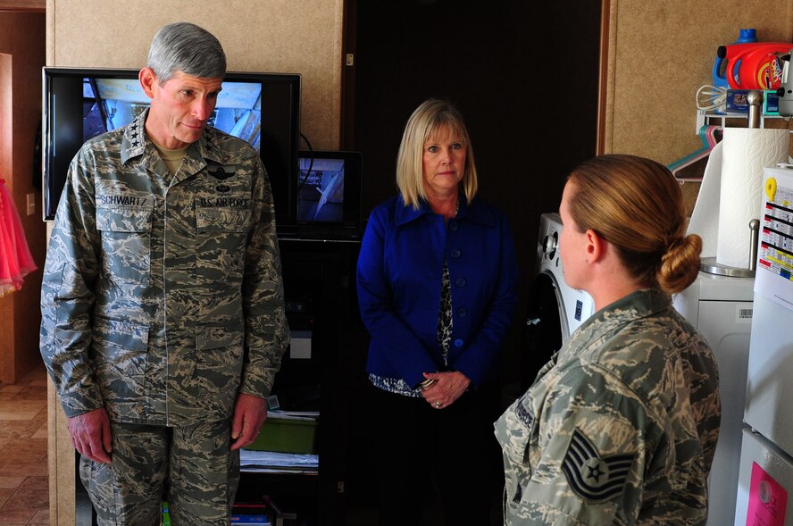 Air Force Chief of Staff Gen. Norton Schwartz and his wife Suzie speak with Tech. Sgt. Natasha Horn  Oct. 4, 2011, in the Horn's Federal Emergency Management Agency trailer in Minot, N.D. Schwartz visited the Horn family to see the flood areas in Minot and how Airmen are recovering. Horn is the 91st Missile Wing executive assistant to the command chief at Minot Air Force Base, N.D.,  (U.S. Air Force photo/Senior Airman Michael Veloz)