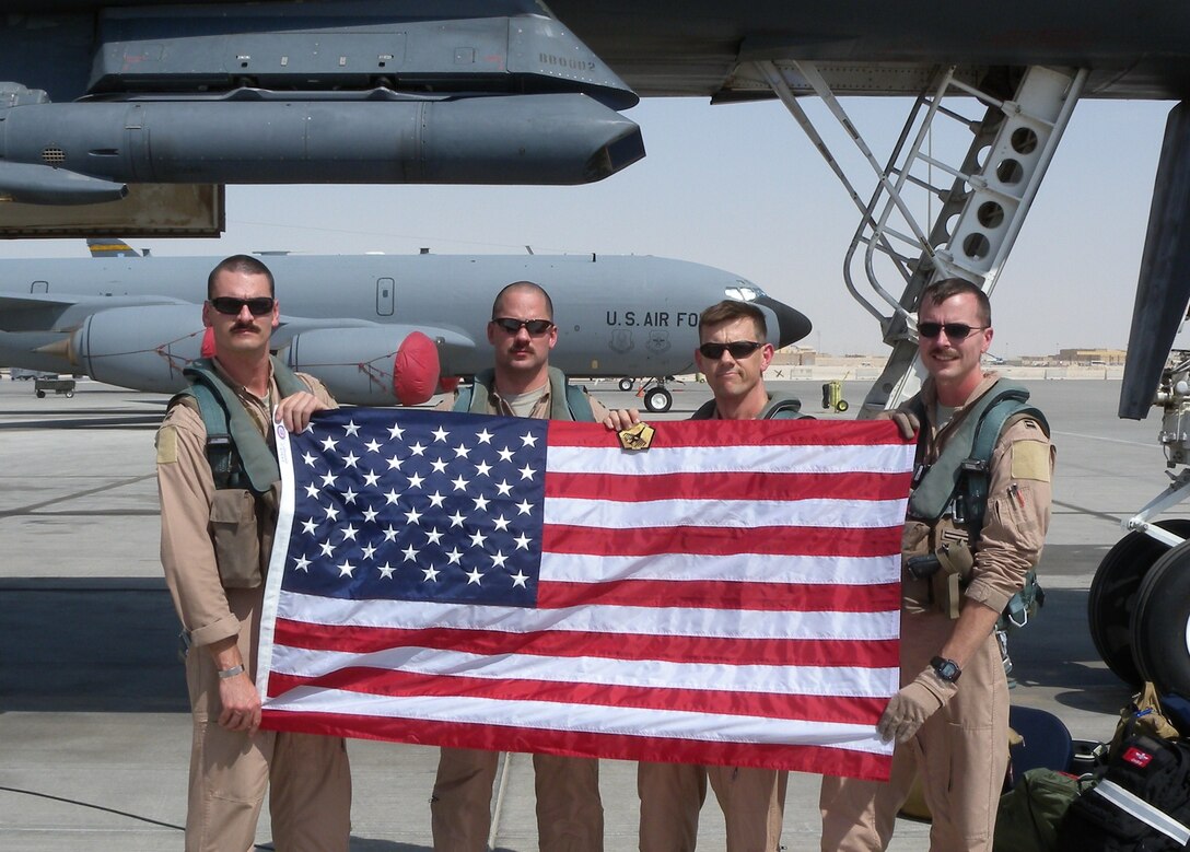 A 34th Expeditionary Bomb Squadron crew who flew a mission Sept. 11, 2011.  34th EBS Commander Lt. Col. John Martin is third from left.