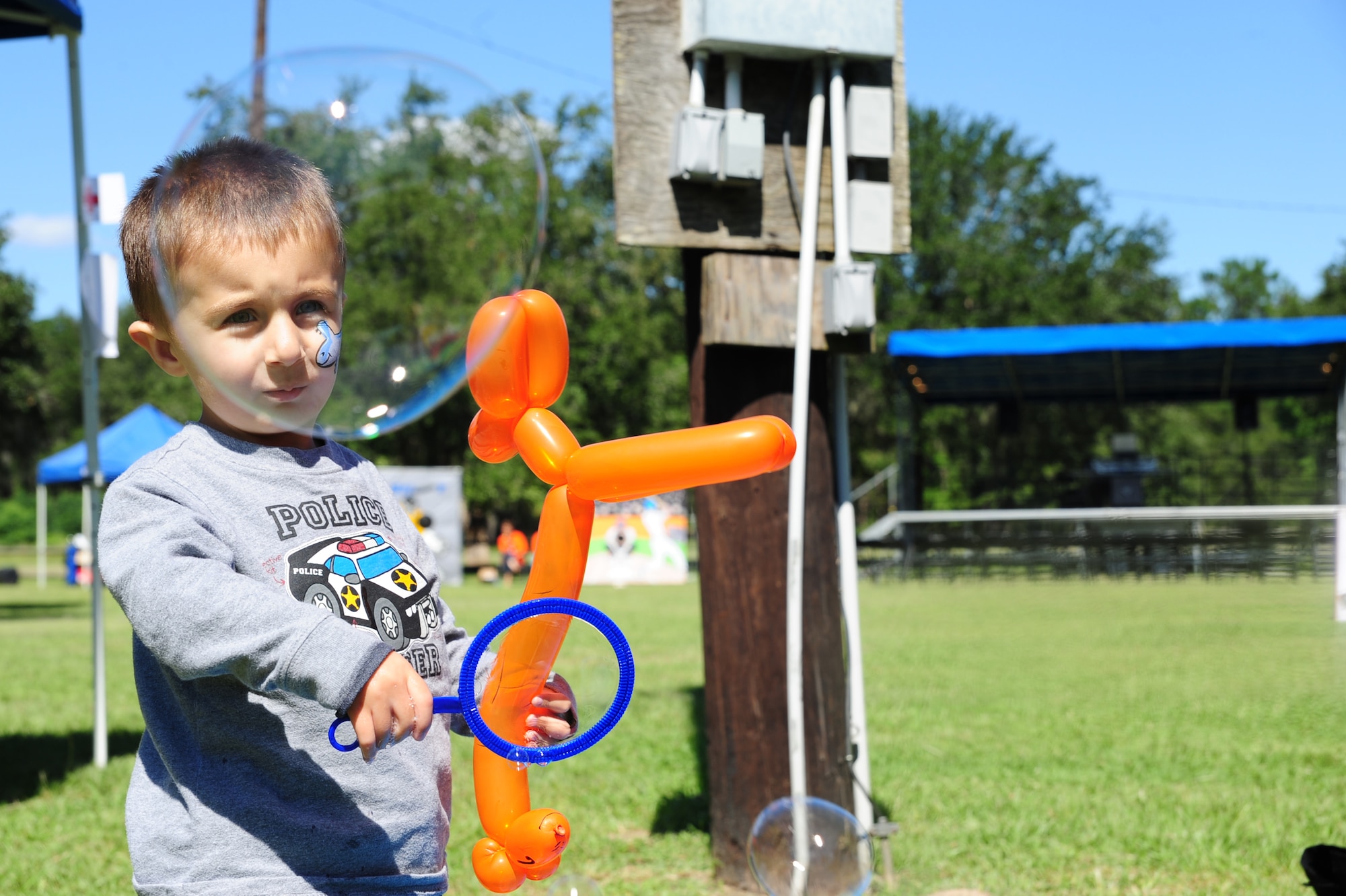 Jack Kordenbrock creates bubbles with a bubble ring at the Child Find/Exceptional Family Member Program Extravaganza ?Special Needs Fair? Oct. 1 at Marrington Plantation, Joint Base Charleston-Weapons Station.The fair is designed to help families with children who have special needs by providing entertainment while  keeping them aware of the resources available on and off base. The extravaganza  featured fun, food, games, prizes and music provided by more than 20 local resources agencies.Jack is the son of Tiffany and Senior Airman Nicholas Kordenbrock assigned 437th Maintenance Operations Squadron.  (U.S. Air Force photo/Tech. Sgt Chrissy Best)
