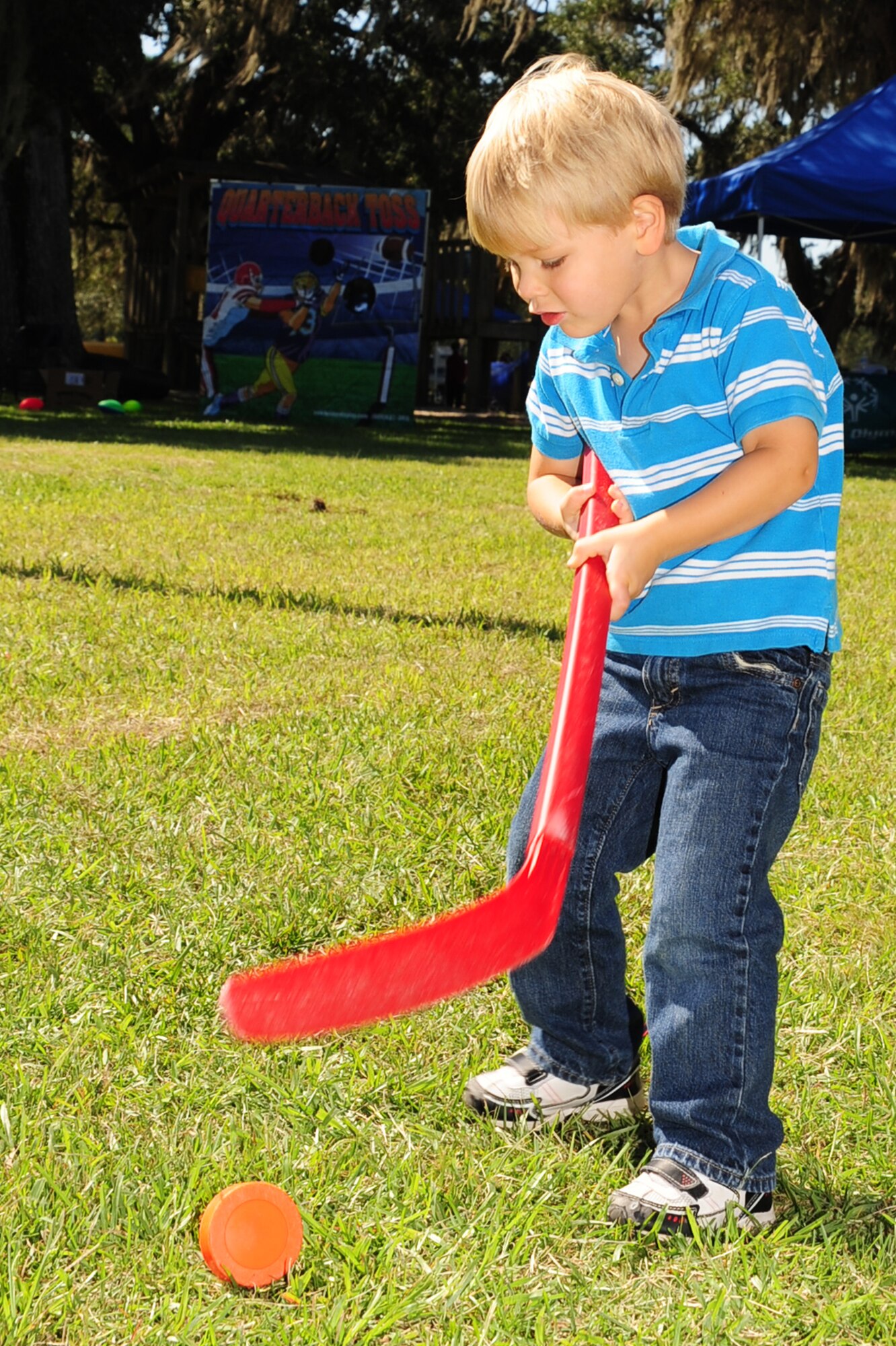 Lucas Helferich takes a shot and the Slap Shot game at the Child Find/Exceptional Family Member Program Extravaganza ?Special Needs Fair? Oct. 1 at Marrington Plantation, Joint Base Charleston-Weapons Station.The fair is designed to help families with children who have special needs by providing entertainment while  keeping them aware of the resources available on and off base. The extravaganza  featured fun, food, games, prizes and music provided by more than 20 local resources agencies. Lucas is son of Michelle and Master Sgt. Joe Helferich assigned to the 628th Communications Squadron. (U.S. Air Force photo/Tech. Sgt Chrissy Best) 
