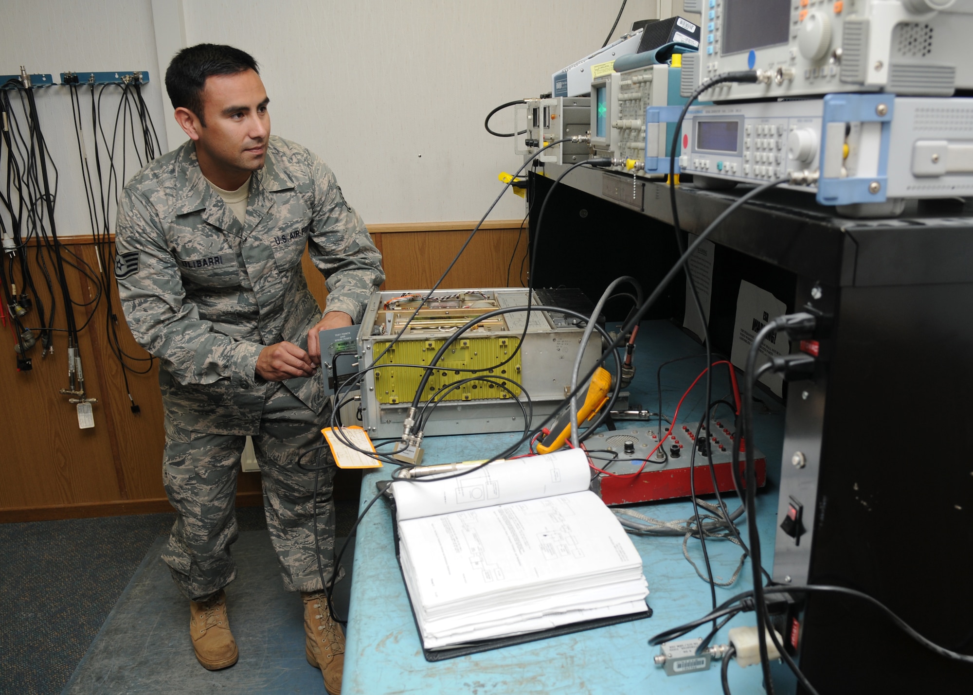 SPANGDAHLEM AIR BASE, Germany – Staff Sgt. Reynaldo Ulibarri, 52nd Communication Squadron radio frequency transmission system technician, conducts a preventative maintenance inspection on a ground-to-air radio here Oct. 4. The radio frequency transmissions shop maintain radios for base weather, command post, base operations and the flying squadrons. The work of the 52nd CS allows different units to communicate effectively to achieve the Saber mission. (U.S. Air Force photo/Senior Airman Christopher Toon)