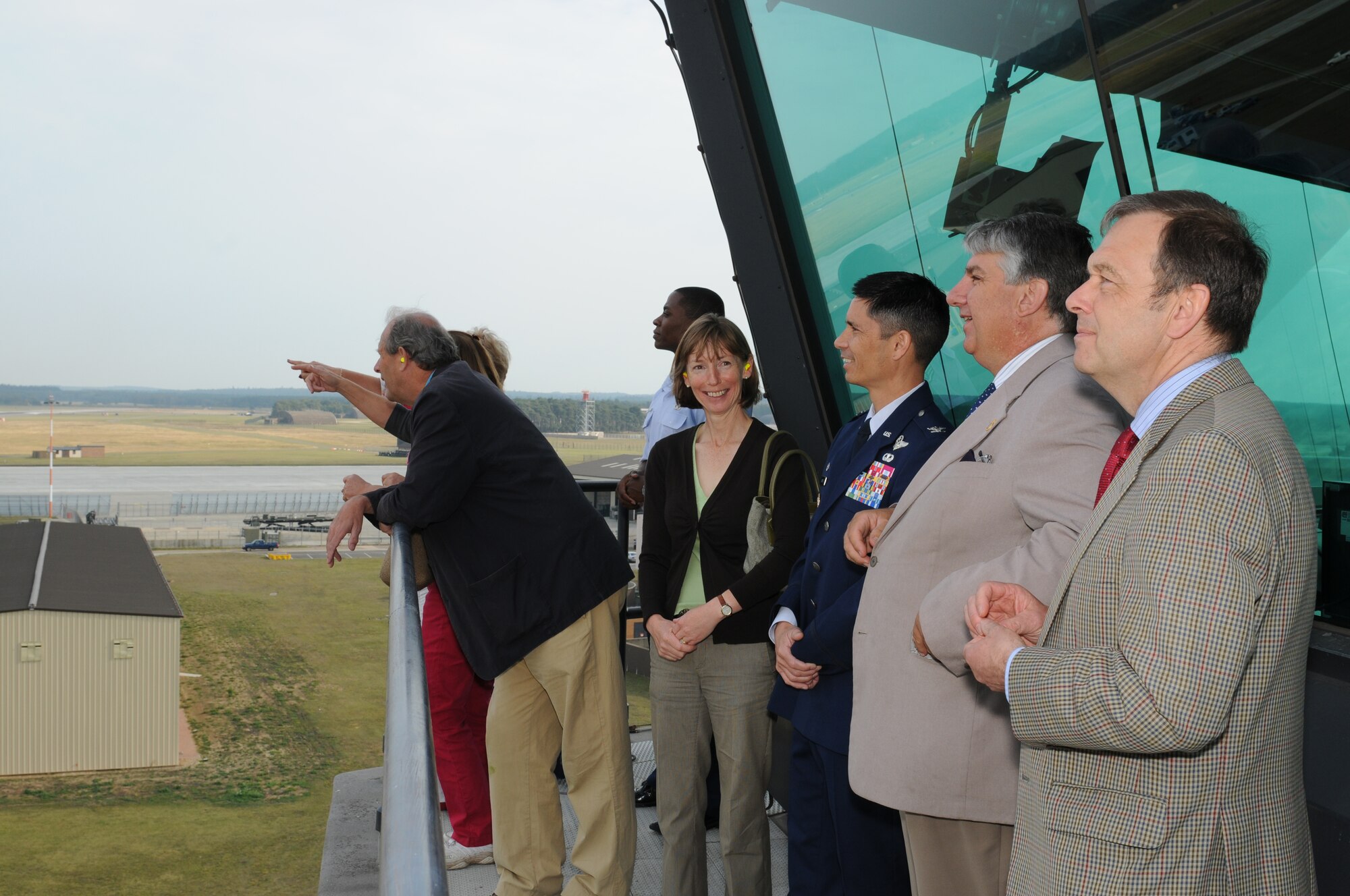 ROYAL AIR FORCE LAKENHEATH, England - The High Sheriffs of Norfolk, Suffolk and Cambridgeshire, along with their spouses and Col. John T. Quintas, 48th Fighter Wing commander, tour the air traffic control tower during a base visit, Oct. 3, 2011.  The High Sheriffs took a tour of the propulsion shop, air traffic control tower, Hangar 7 and the child development center to continue to build partnership capacities with local community leaders.  (U.S. Air Force photo by Airman Cory D. Payne)