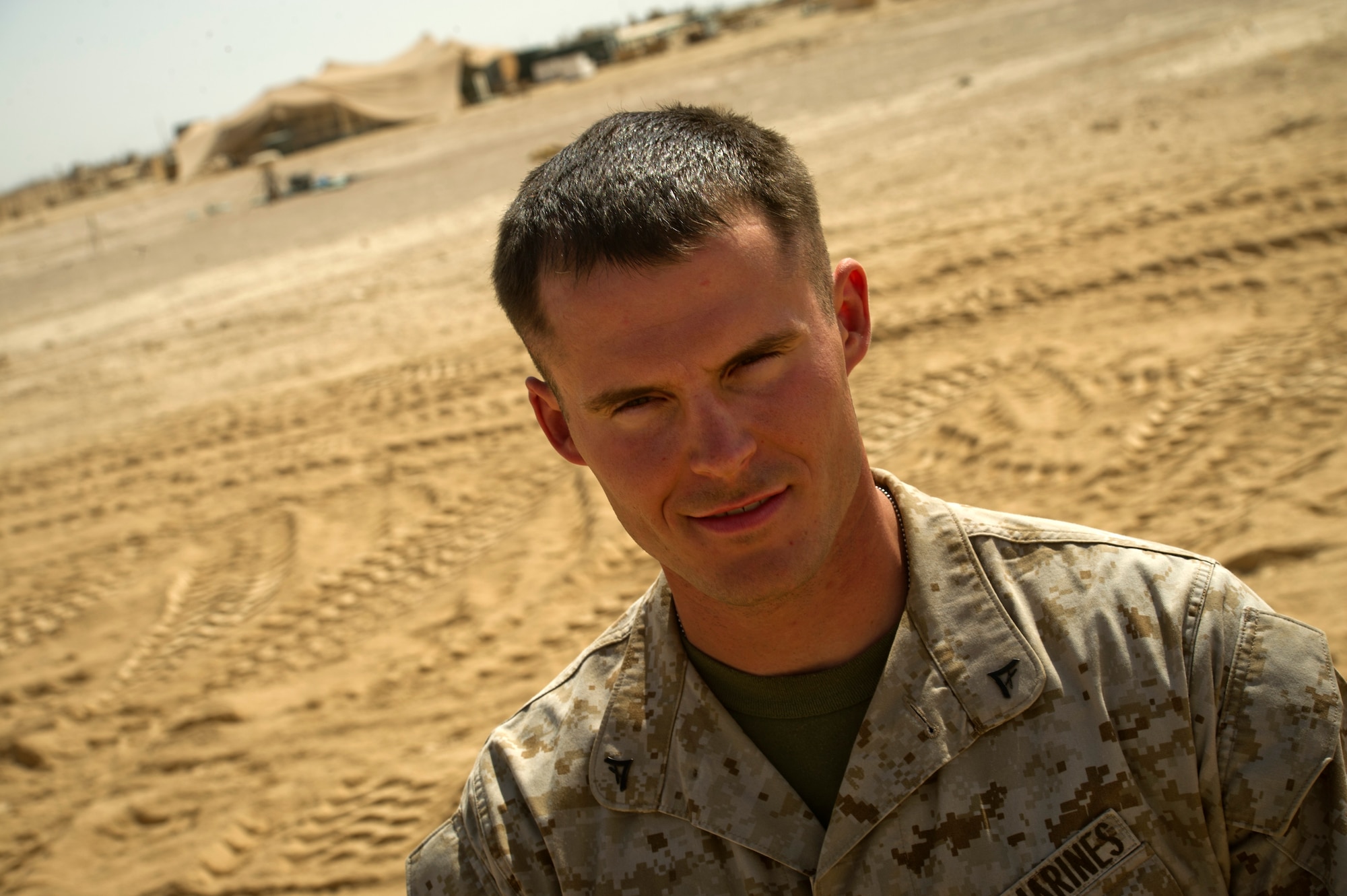 U.S. Marine Corps. Lance Cpl. Peter Leonard, a Marine with Combat Logistics Battalion 6, is the second in charge of arrival, departure and airfield control section at Forward Operating Base Edinburgh. His duties include coordinating airdrops with the Air Force for FOB Edinburgh. (U.S. Air Force photo by Staff Sgt. David Salanitri) 