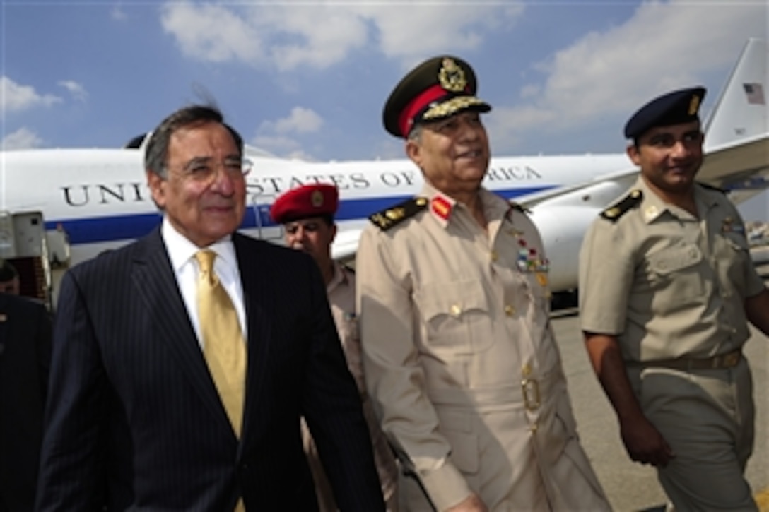 Egyptian Maj. Gen. Rouini escorts Secretary of Defense Leon Panetta to his motorcade as he arrives in Cairo, Egypt, on Oct. 4, 2011. Panetta is traveling in the Middle East to meet with key allies in the region to discuss a variety of defense related issues.  