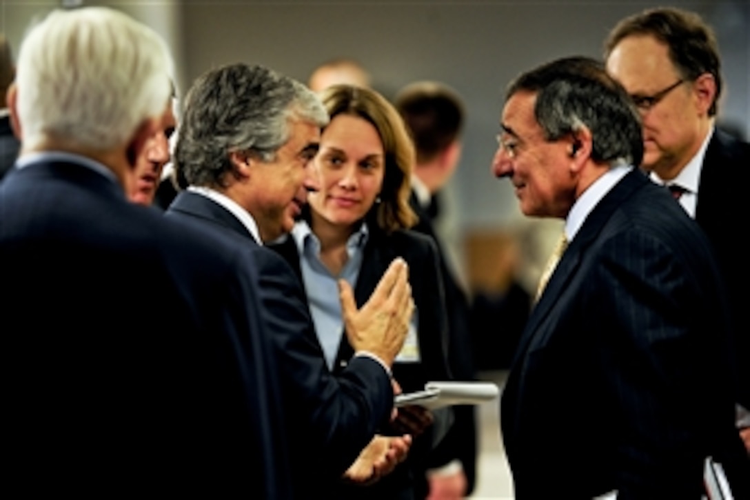 U.S. Defense Secretary Leon E. Panetta talks with Portuguese Defense Minister Jose Pedro Aguiar-Branco at NATO headquarters in Brussels, Belgium, Oct. 5, 2011. Panetta is meeting with NATO counterparts and defense leaders to discuss lessons learned during NATO operations in Libya and Afghanistan, and the alliance's future defense needs.