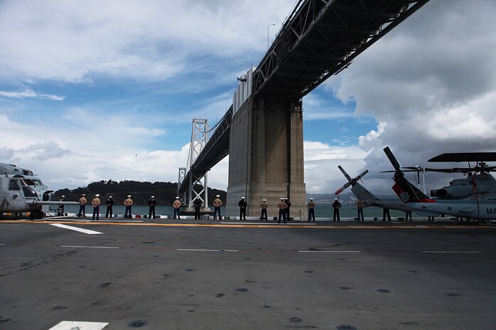 Static displays of Marine aircraft flank Marines and sailors with I Marine Expeditionary Force and USS Bonhomme Richard as they pass under the San Francisco-Oakland Bay Bridge on their way to Fleet Week to demonstrate their air, land and sea capabilities here, Oct. 5. The annual event will take place at various locations throughout San Francisco Oct. 5-11. Fleet Week gives Marines and sailors aboard USS Bonhomme Richard a chance to demonstrate assets, capabilities and the Corps’ amphibious nature, readiness and ability to respond to disasters.
