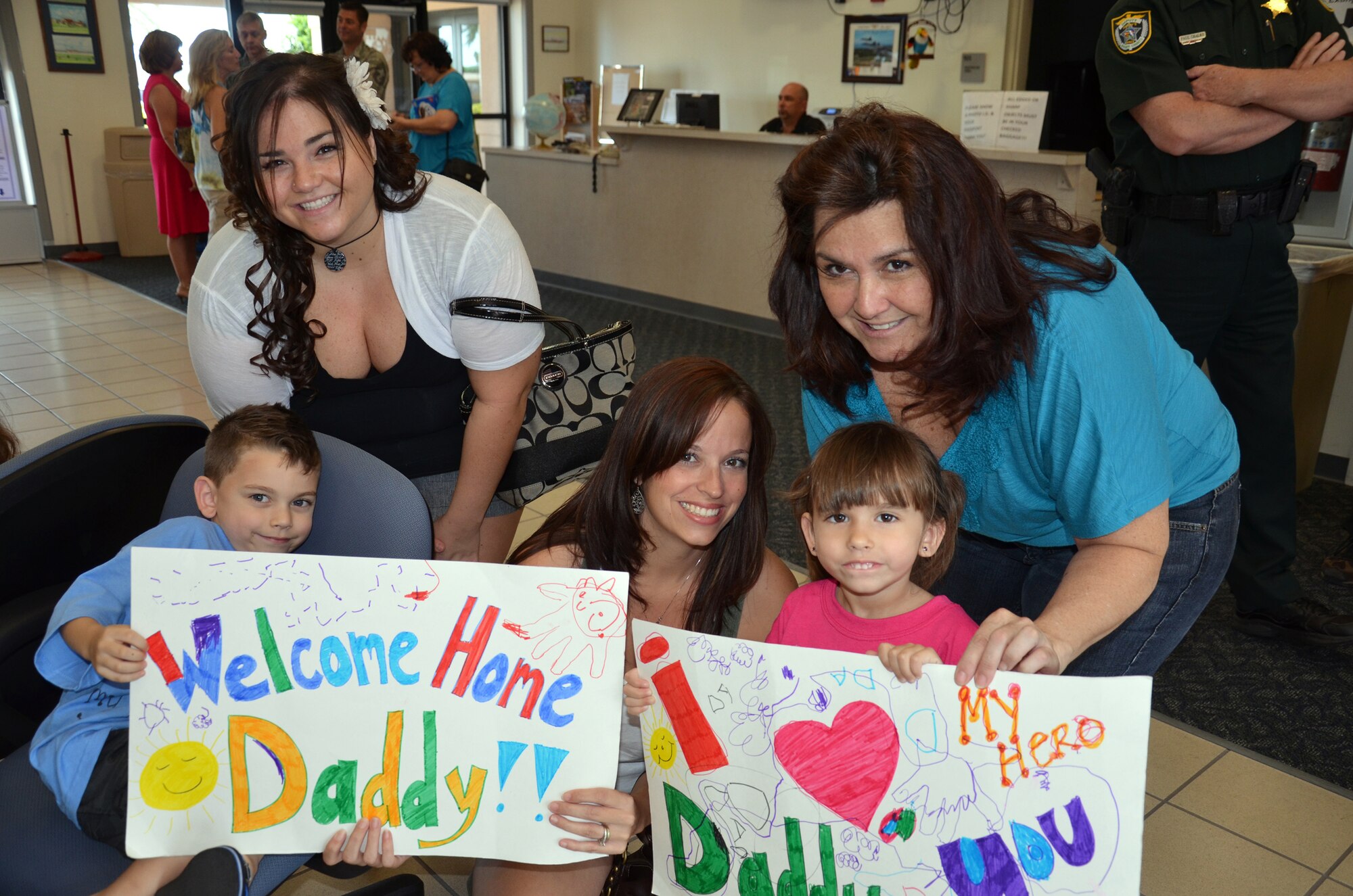 PATRICK AIR FORCE BASE, Fla.- Staff Sgt. Steve Tielsch's, a structural technician, family are all smiles as they wait for his arrival here. Over 40 Rescue Reservists were welcomed home by friends and family after being deployed in Afghanistan for four months. (U.S. Air Force photo/Airman 1st Class Natasha Dowridge)