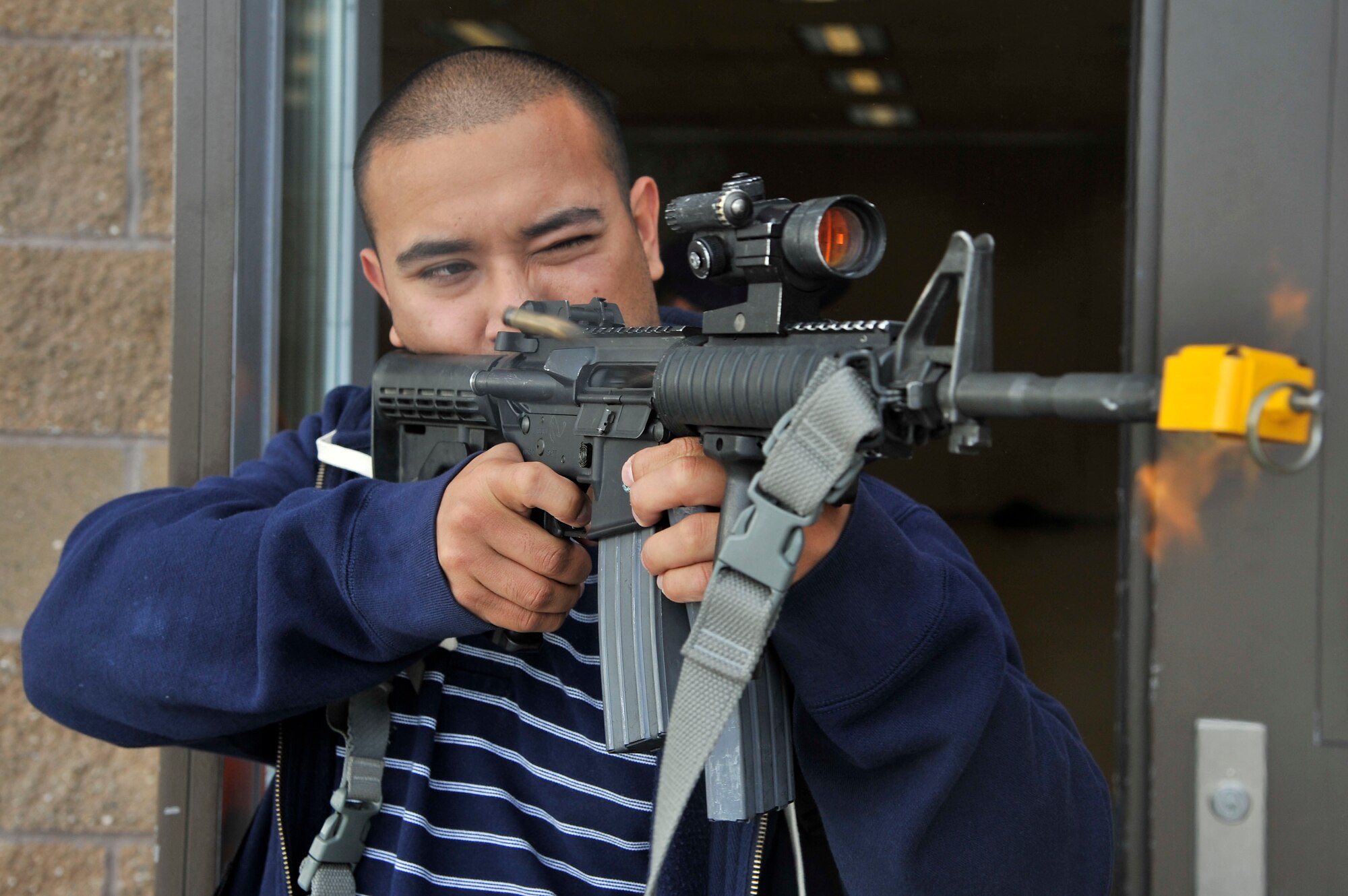 Robert Gonzales fires blank rounds out of an M4 rifle during an active shooter exercise Sept. 28, 2011, Eielson Air Force Base, Alaska. Gonzales acted as an aggressor to test first responders during the exercise. Gonzales is assigned to the 354th Security Forces Squadron. (U.S. Air Force photo/Staff Sgt. Christopher Boitz)