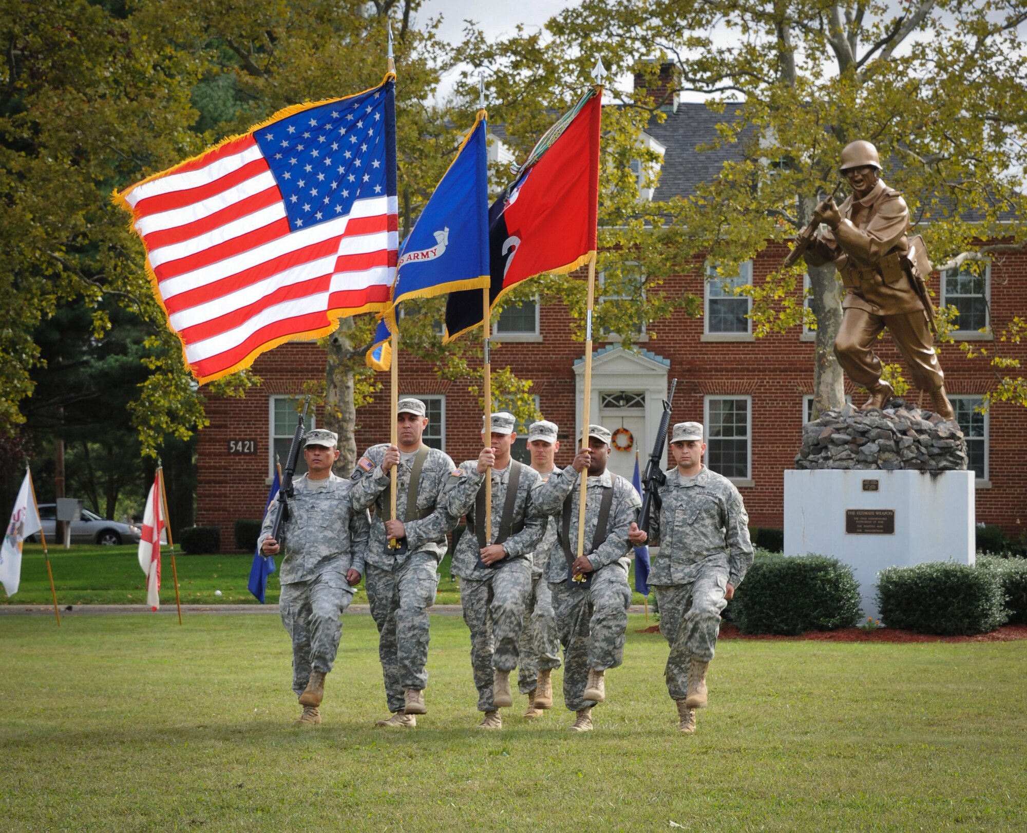 The 2nd Brigade, 75th MCT Div. color guard advances the colors in front of the statue of the Ultimate Weapon during a change of command ceremony Oct. 2 at Sharp Field. Maj. Gen. Jimmie Wells charged Brig. Gen. John Turner III with command of the 2nd Brigade. The change of command is a time-honored tradition which formally announces the continuity of the authority of command. (U.S. Air Force photo by Airman Ryan Throneberry/Released)