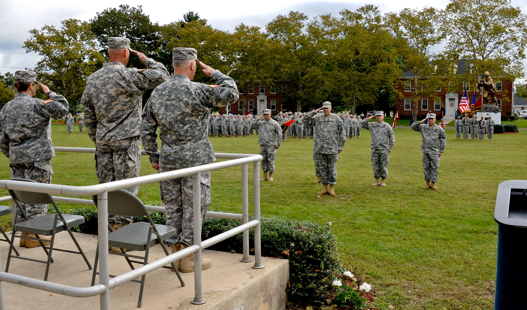 Soldiers with the 2nd Brigade 75th Mission Command Training Division render a salute during the playing of Ruffles and Flourishes honoring Maj. Gen. Jimmie Wells as part of the change of command ceremony Oct. 2 at Sharp Field.  The change of command is a time-honored tradition which formally announces the continuity of the authority of command. (U.S. Air Force photo by Airman Ryan Throneberry/Released)