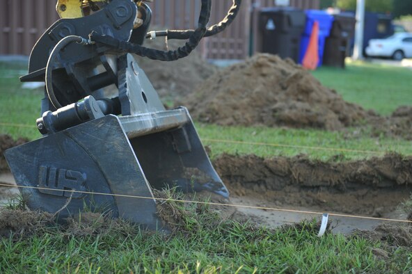 The bucket of an excavator digs up dirt during a Visitor's Center project on Seymour Johnson Air Force Base, N.C., Oct. 4, 2011. Excavators are heavy construction equipment consisting of a boom, stick, bucket and cab on a rotating platform used to dig. The 4th Civil Engineer Squadron structural shop handles everything from the ground to the roof and the insides of 335 facilities here. (U.S. Air Force photo by Senior Airman Whitney Stanfield) 

