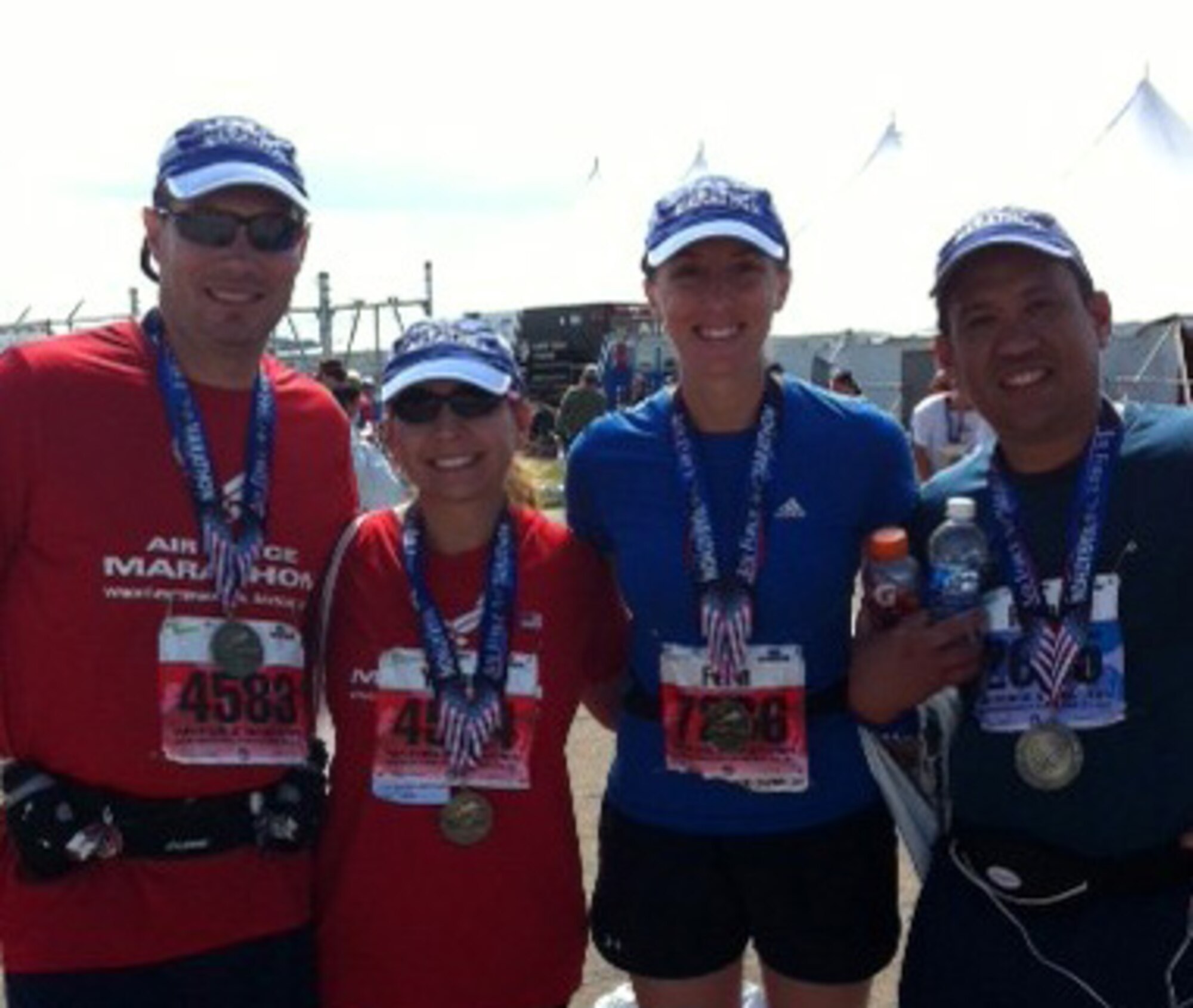 Fitness fanatics from the 446th Airlift Wing take stride during their annual tour to participate in the 15th Annual Air Force Marathon at Wright-Patterson Air Force Base, Ohio Sept. 17.  From left to right, Master Sgt. Keith Chase, from the 446th Maintenance Squadron, joins his wife, Tech. Sgt. Yvonne Chase along with Master Sgt. Fern Michael and Maj. Regan Ramos from the 446th Aeromedical Staging Squadron to conquer the course.   (U.S. Air Force photo by Staff Sgt. Jennifer White)