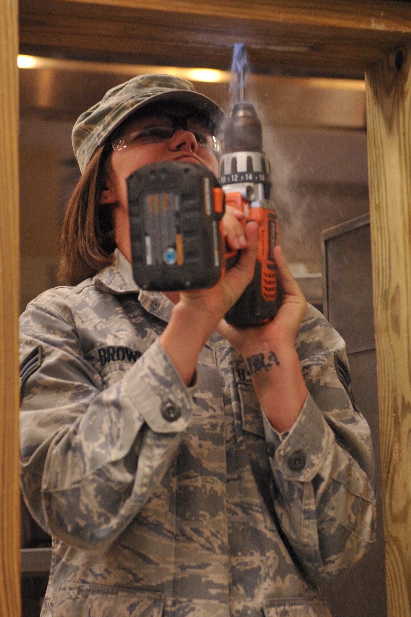 Senior Airman Keny Brown drills a hole in a frame during a dining facility project on Seymour Johnson Air Force Base, N.C., Oct. 4, 2011. The structural shop receives work orders each week for projects around the base. Work orders consist of the requirements being requested and a completion date. Brown is a 4th Civil Engineer Squadron structural journeyman and a native of Savannah, Ga. (U.S. Air Force photo by Senior Airman Whitney Stanfield)