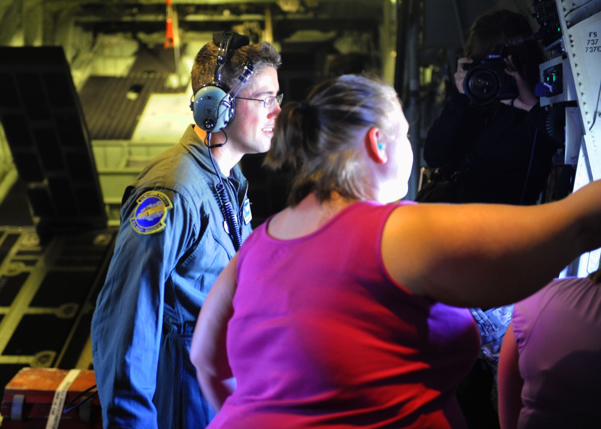 A Dyess spouse looks out the window during a flight on a C-130J, Sept. 30, 2011, at Dyess Air Force Base, Texas. The flight allowed spouses a chance to see what their significant other does on a daily basis. (U.S. Air Force photo by Airman 1st Class Cierra Bullock/Released)
