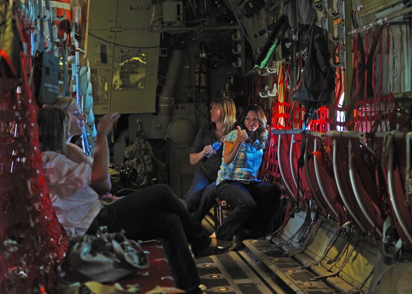 Dyess spouses ride in a C-130J for the spouse flight, Sept. 30, 2011, at Dyess Air Force Base, Texas. The flight was available to all the dyess spouses to enjoy a 30-minute ride in the aircraft as well as lunch and activities afterwards. (U.S. Air Force photo by Airman 1st Class Cierra Bullock/Released)