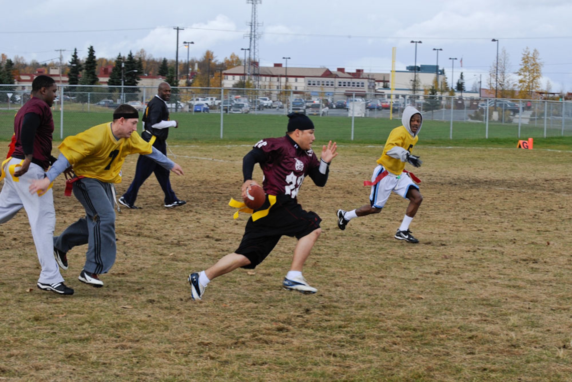 Louie Jaramillo of the  56th Engineer Company, breaks away for a touch down during the intramural flag football tournament on Joint Base Elmendorf-Richardson Sunday afternoon. The 56th Engineers carried the day with a score of 20-15. Intramural sports action continues year-round on JBER. (U.S. Air Force photo/Steve White)