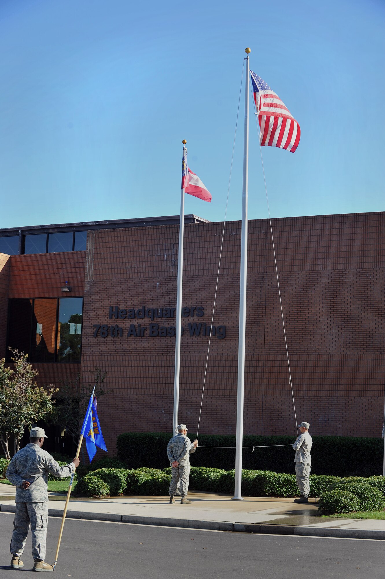 Members of the 78th Air Base Wing conduct a Retreat Ceremony Sept. 28 in front of Bldg. 905. U. S. Air Force photo by Tommie Horton