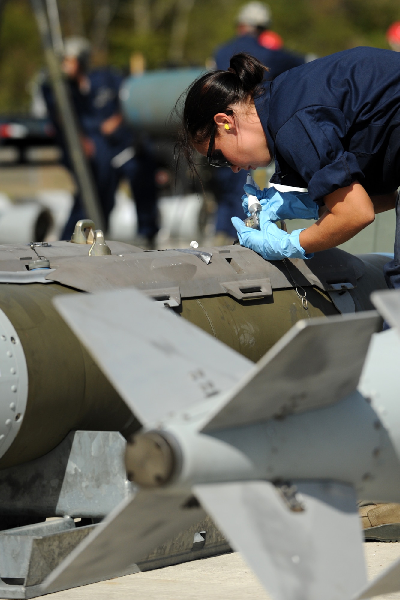 U.S. Air Force Airman 1st Class Teresa Procell, 307th Maintenance Squadron munitions technician, puts the final touches on the assembly of a simulated 2000-pound Joint Direct Attack Munition during the bomb-build evaluation for the 2nd annual Global Strike Challenge competition at Barksdale Air Force Base, La., Oct. 5, 2011. The Global Strike Challenge is the world's premier bomber, Intercontinental Ballistic Missile and security forces competition with units from the Air Force Global Strike Command, Air Combat Command, Air Force Reserve Command and the Air National Guard, and the official score-posting will be at Barksdale, Nov 8-9. (U.S. Air Force photo by Master Sgt. Greg Steele/Released)