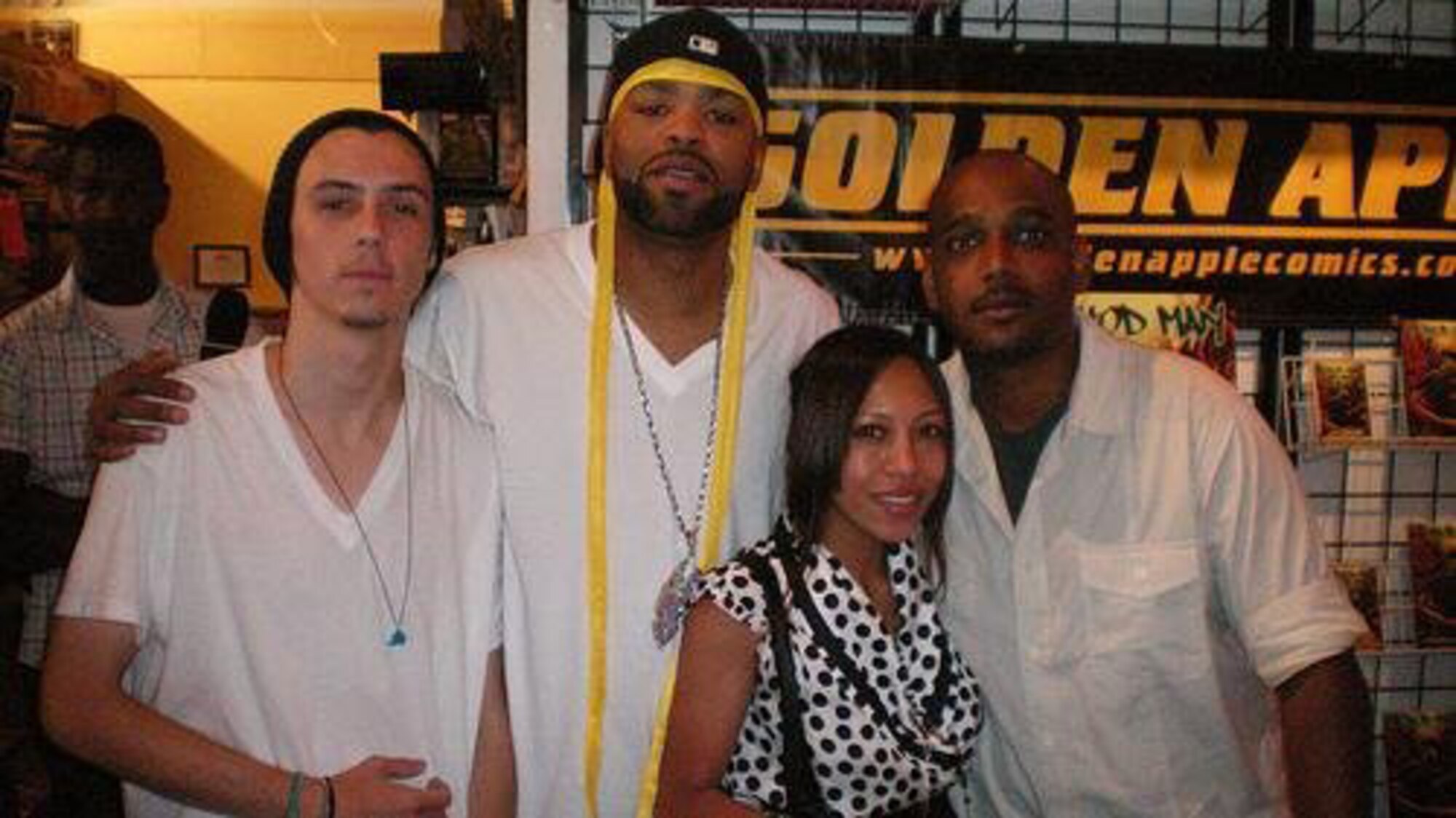 David Atchison (right) with entertainer Method Man (center) and two fans during a comic book signing for the "Method Man" comic book. Atchison wrote the story for the comic. (Courtesy photo)
