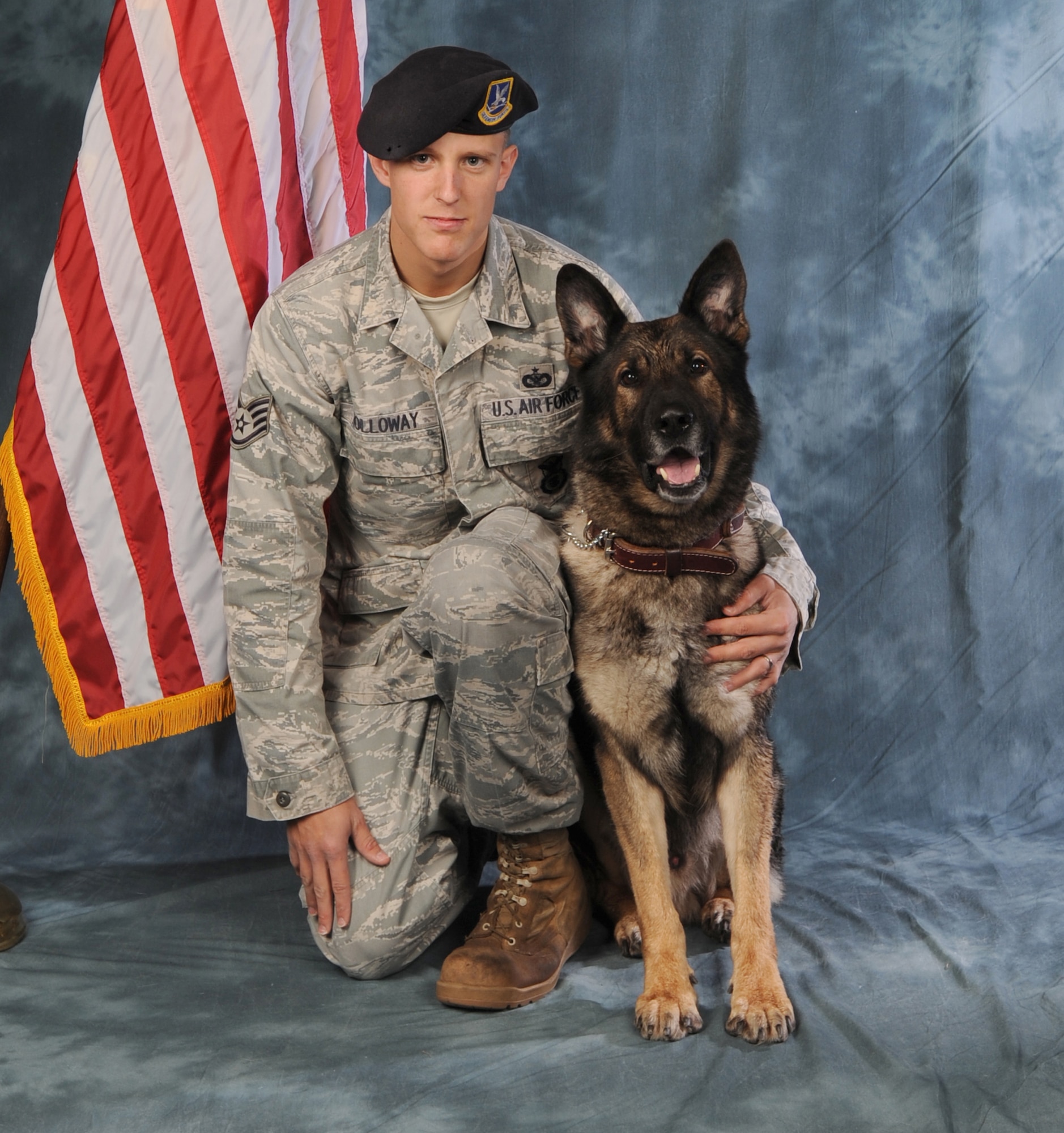 WHITEMAN AIR FORCE BASE, Mo. -- The Exercise Tiger Foundation honored Staff Sgt. Alex Holloway, 509th Security Forces Squadron canine handler, and Filo, a six-year-old Military Working Dog, for the first national Blue Tiger award and were inducted into 2011 National Exercise Tiger Foundation.