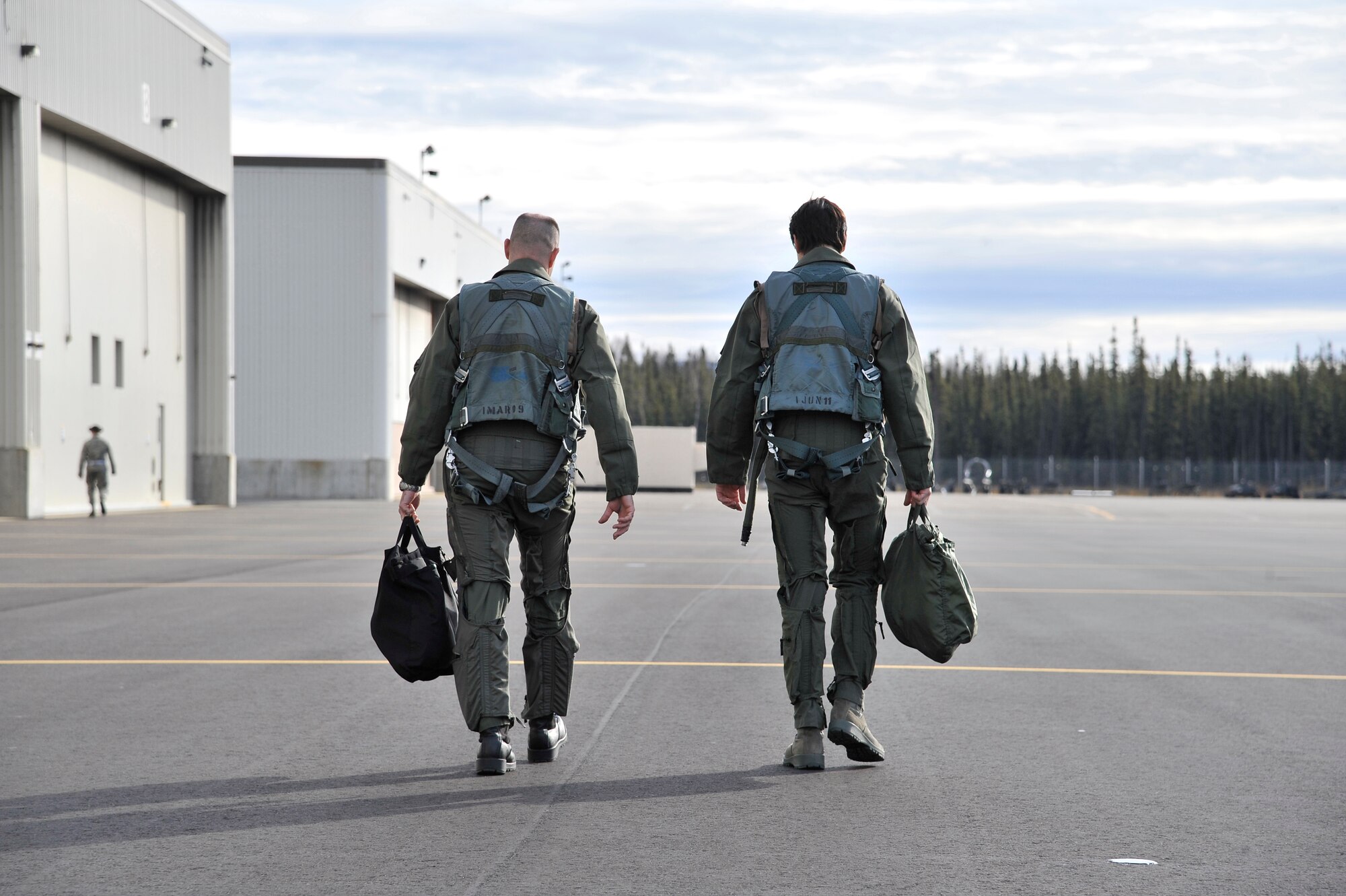 Lt. Col. Todd Emmons, left, and Ryan Binkley, right, walk to an F-16 Fighting Falcon for a familiarization flight Sept 29, 2011, Eielson Air Force Base, Alaska. Emmons is the 18th Aggressor Squadron commander and Binkley is the honorary commander of the 18th AGRS and a prominent member of the Fairbanks community. (U.S. Air Force photo/Staff Sgt. Christopher Boitz)