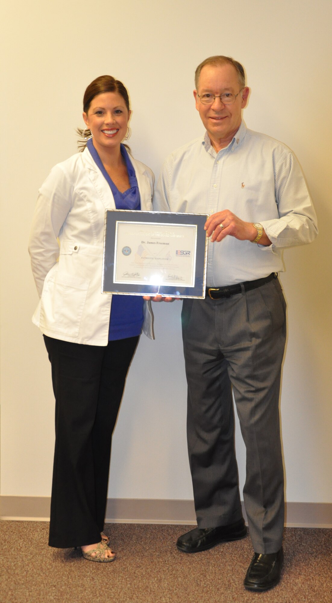 WRIGHT-PATTERSON AIR FORCE BASE, Ohio – Drs. James Freeman (pictured here) and Lee Hendricks both received the Employer Support of the Guard and Reserve Patriot Award Oct. 4 in recognition for their support of Mrs. Leslie Hutchison, wife of Tech. Sgt. Jason Hutchison, 445th Aeromedical Evacuation Squadron. Leslie nominated her employers for the award for their support of her and her family while her husband was deployed. (U.S. Air Force photo/Stacy Vaughn)