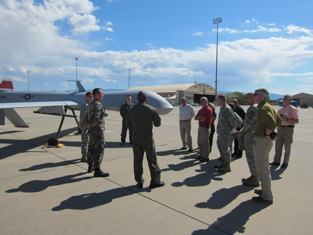 Local community leaders and military personnel from Charleston, S.C. receive an introduction to remotely piloted aircraft during a visit to Holloman Air Force Base, N.M., as part of a two day civic leader tour Sept. 26 and 27. The group also made stops to the U.S. Air Force Academy and Schriever Air Force Base, Colo. Other tour highlights included an orientation to one of the Air Force’s commissioning sources and an introduction to military satellite systems. Civic leader tours are designed to showcase some unique, yet important mission areas in order to provide the local community with a better understanding of Air Force operations. (U.S. Air Force photo/Michaela Judge)