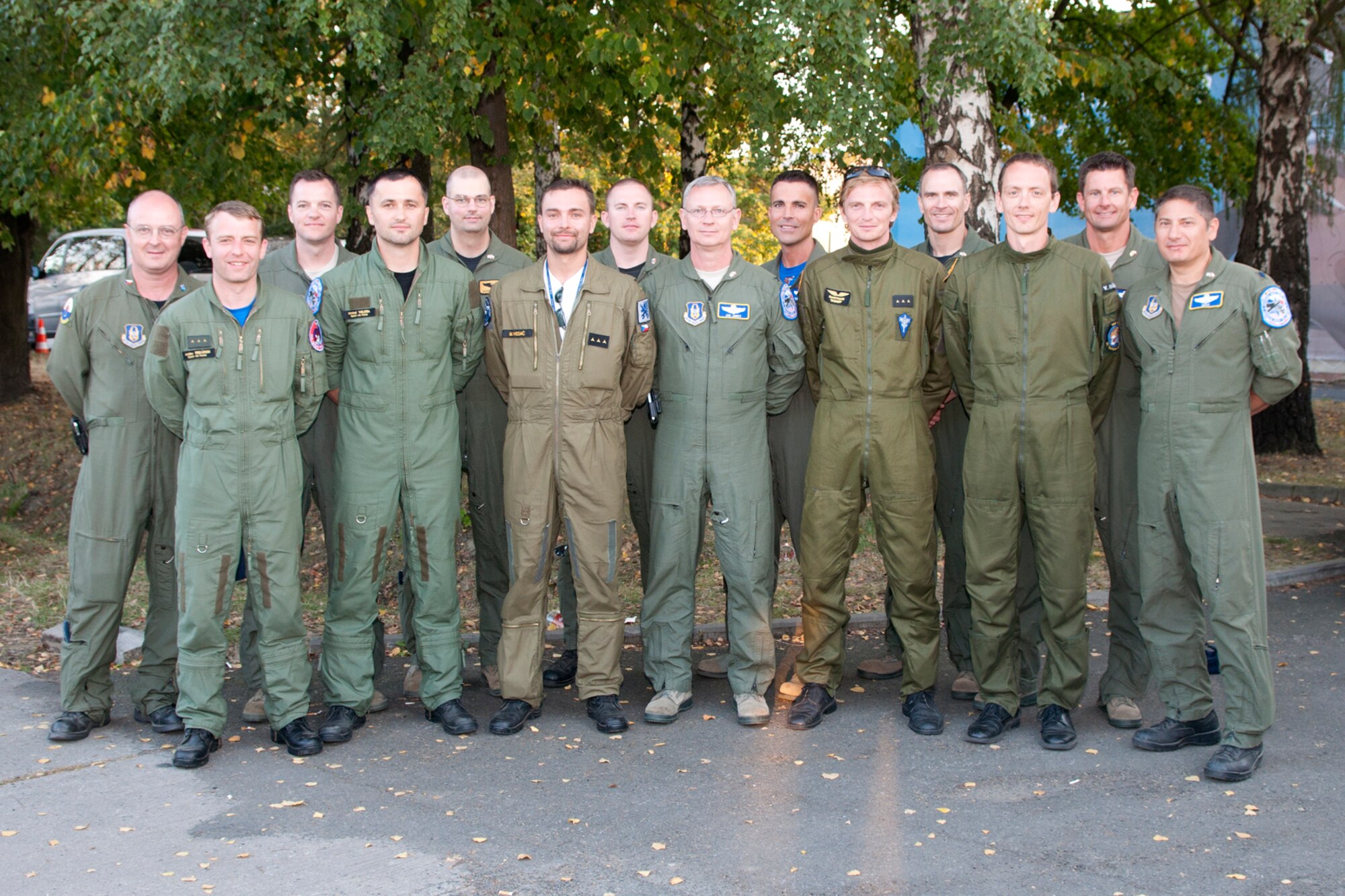 (L-R) Lt. Col. David Webb, 307th Operations Support Flight commander, 1st Lt. Jaroslav Pekárek, Advanced Light Combat Aircraft (ALCA) pilot, Capt. Casey Gough, 93rd Bomb Squadron instructor pilot, 1st Lt. Michal Veleba, ALCA pilot, Capt. Jason Doleman, 11th Bomb Squadron instructor electronic warfare officer, 1st Lt. Michal Hodac, ALCA pilot, Capt. Eric Barkley, 11th BS instructor radar navigator, Col. Joseph Jones, 307th Bomb Wing vice commander, Capt. Kerry Baker, 93rd BS instructor radar navigator, 1st Lt. Kamil Ko?ac, Gripen pilot, Maj. Stephen Dujmovic, 93rd BS pilot, 1st Lt. Vladimír Málek, Gripen pilot, Maj. Pat Booker, 93rd BS instructor pilot, and Lt. Col. Pete Costas, 93rd BS pilot, pose for a photo at the Ostrava airport in the Czech Republic, Sept. 25, 2011. The Airmen, from both the U.S. Air Force and the Czech Republic Air Force had just completed a mission planning session for a joint training mission scheduled for the next day. A B-52 Stratofortress from the 93rd Bomb Squadron, 307th Bomb Wing, Barksdale Air Force Base, La., arrived in the Czech Republic to participate in the NATO Days in Ostrava air show, which is the largest air, military and security show in Central Europe. (U.S. Air Force photo by Tech. Sgt. Jeff Walston/Released)