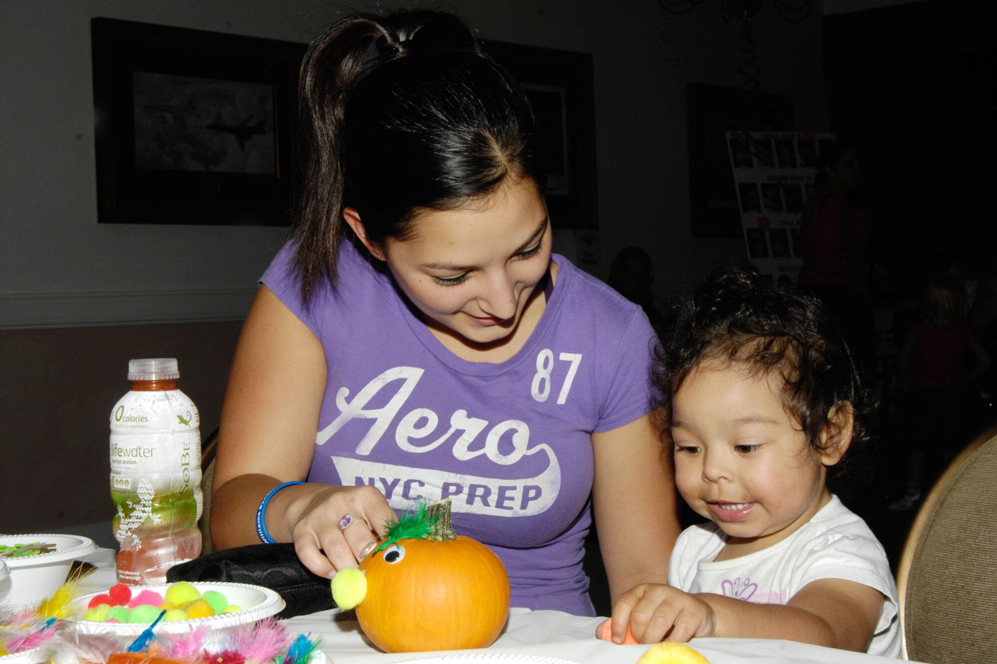 HANSCOM AIR FORCE BASE, Mass. – Colleen and Alexis Riley decorate a pumpkin during Oktoberfest at the Minuteman Commons Sept. 30. The annual fall event included German food and beverages, polka and waltz music, fun and games for the kids and more. (U.S. Air Force photo by Linda LaBonte Britt)