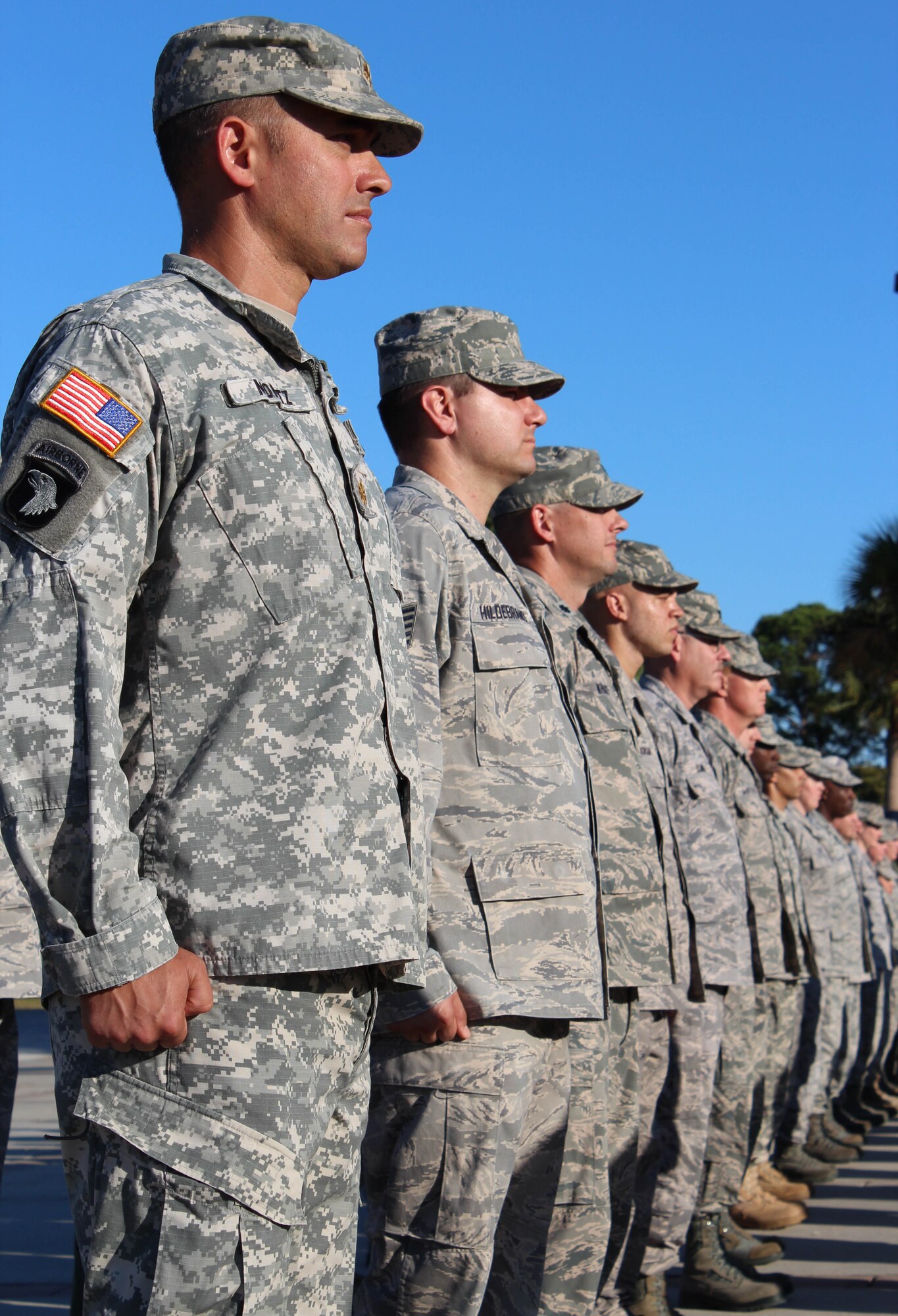 Members of 1st Air Force stand in formation during a formal Air Force Retreat ceremony at the 325th Fighter Wing Flag Park at Tyndall Air Force Base, Fla., Oct. 5. Retreat is military tradition that pays tribute to the American flag and signifies the end of the duty day. (U.S. Air Force photo by Angela Pope) 